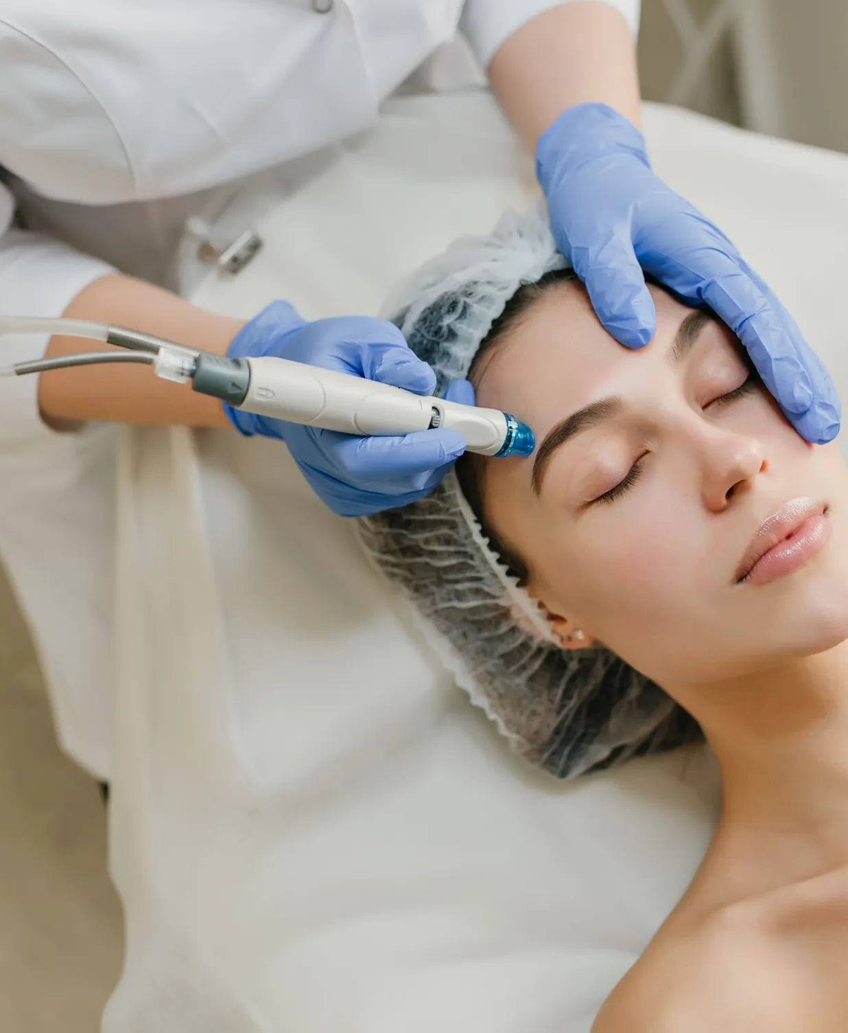 A woman getting a botilage injection from a doctor.