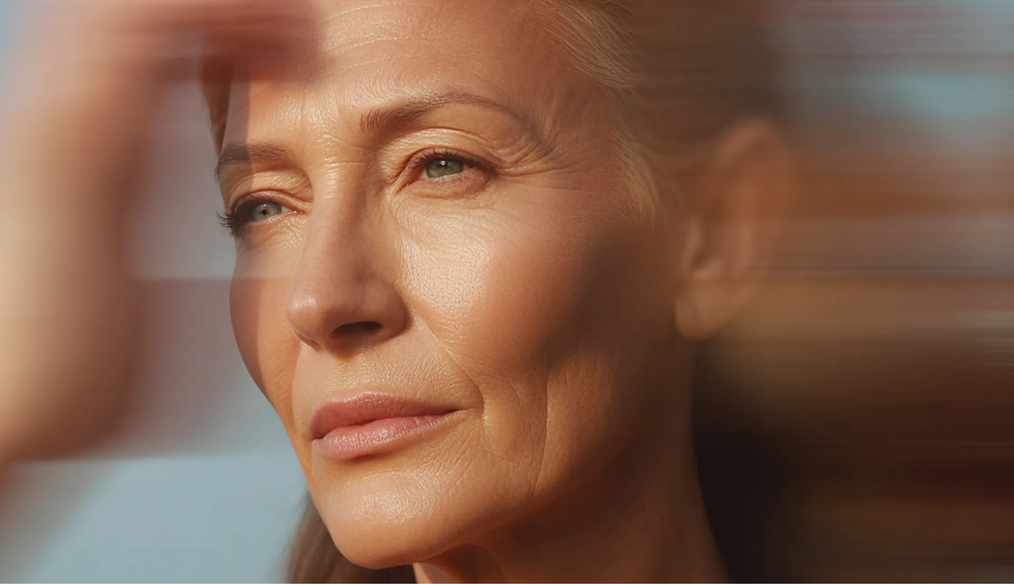 A woman is looking at something with a blurry background.