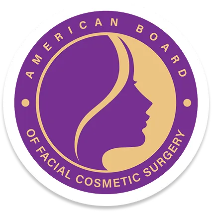 Circular logo with a purple background and a beige profile silhouette of a woman's face, bordered by text reading 'American Board of Facial Cosmetic Surgery'.