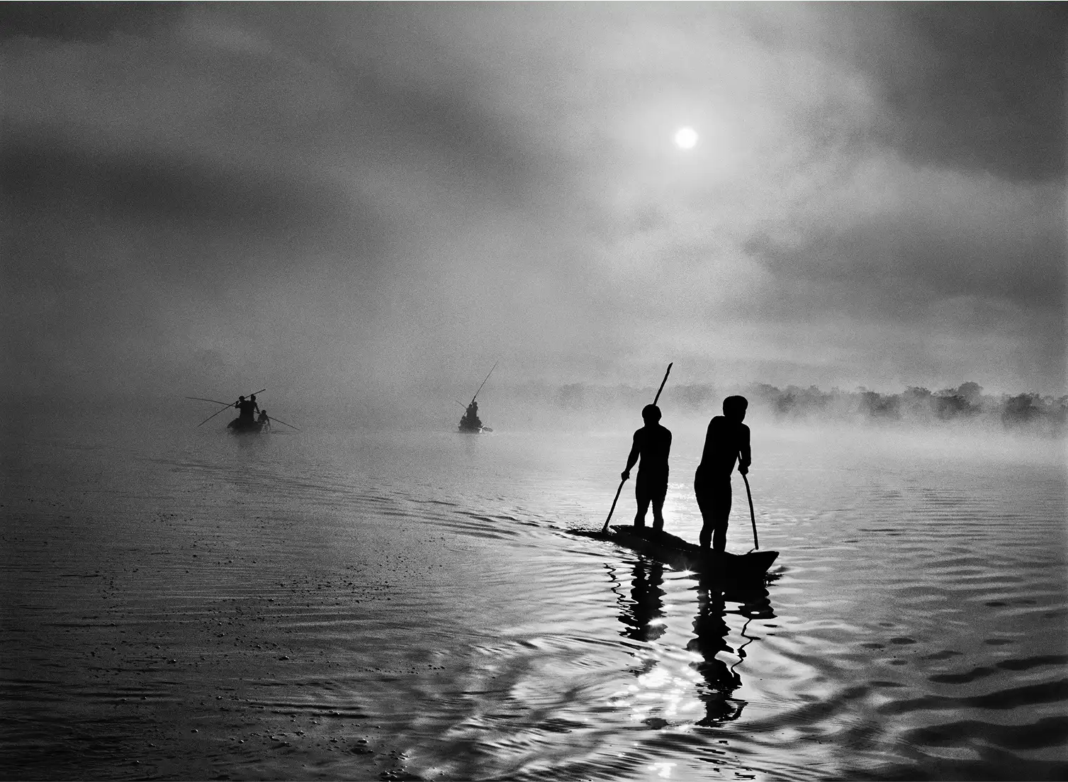 Image of two people on a small boat on a river