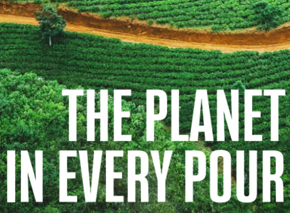 Green field with displayed text over image saying "The Planet in every pour"