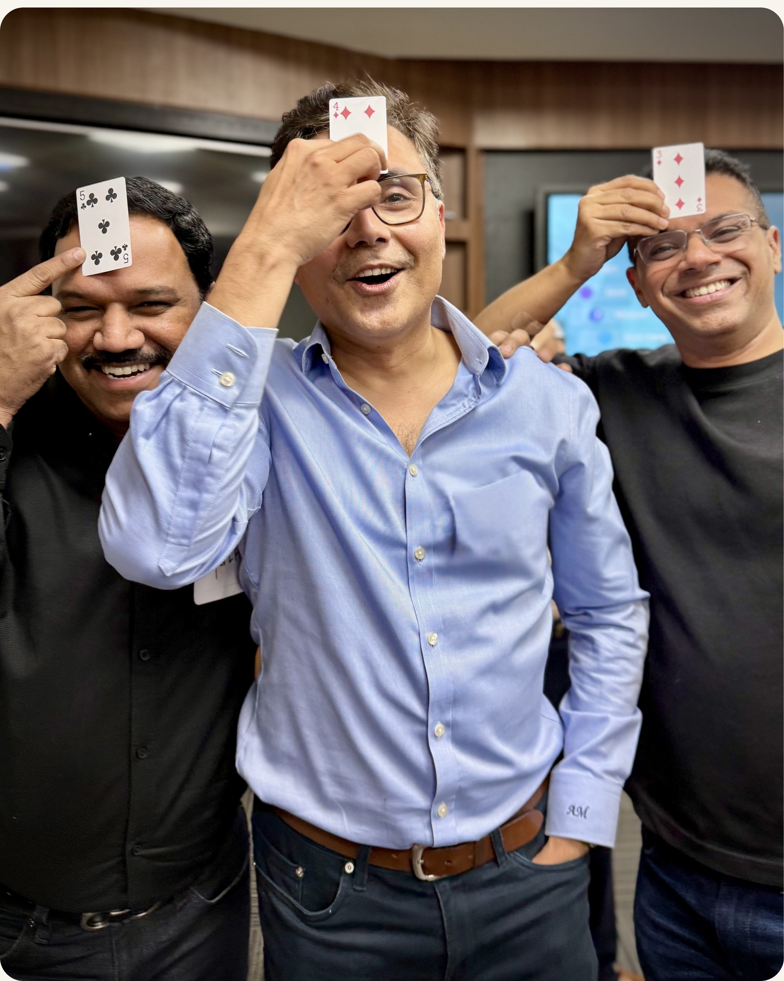 Senior leaders laughing and engaged during a CoachVikram executive presence training cohort session