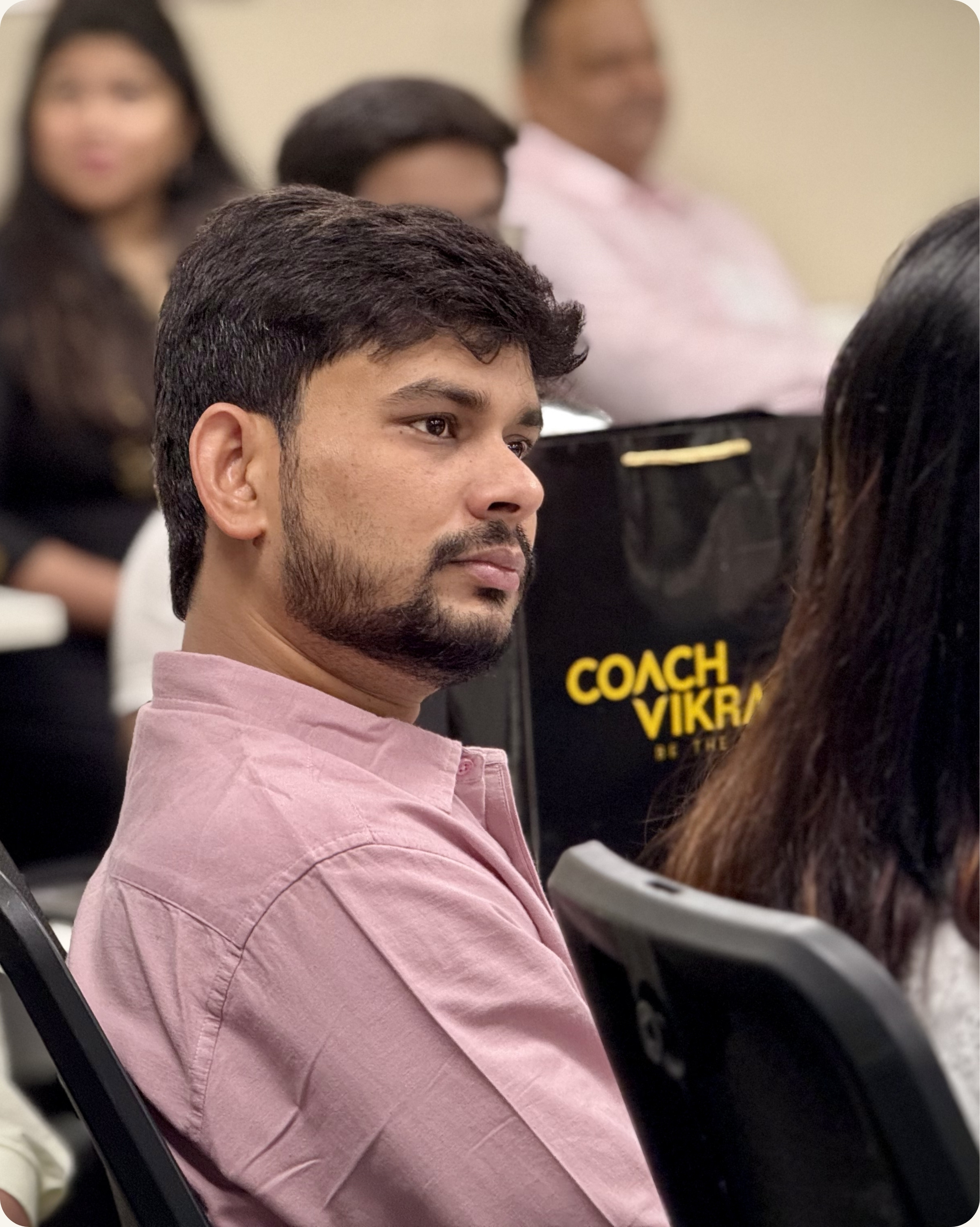 Senior leader listening attentively during executive presence training session in Bengaluru India — CoachVikram & Company