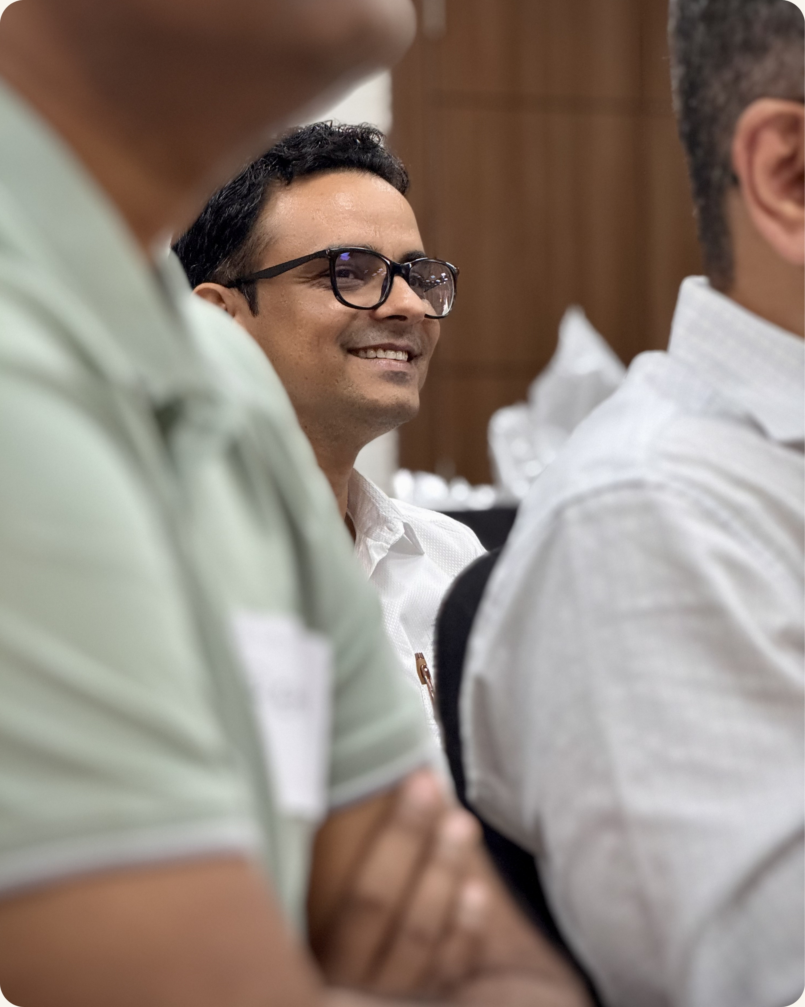 Senior leader smiling confidently during executive presence workshop in Bengaluru India — CoachVikram & Company