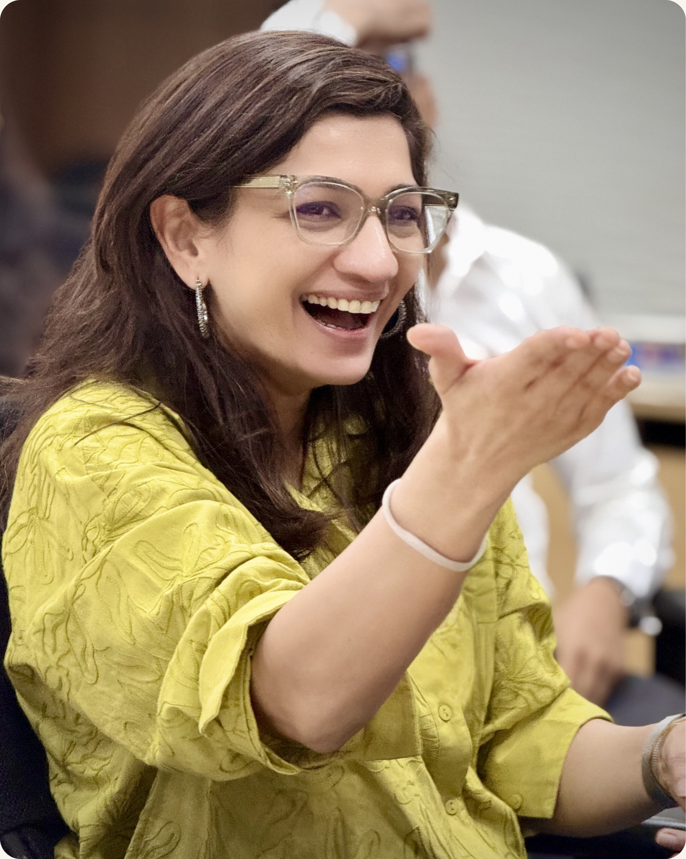 Senior leader joyfully engaged during executive presence training session — CoachVikram & Company Chicago