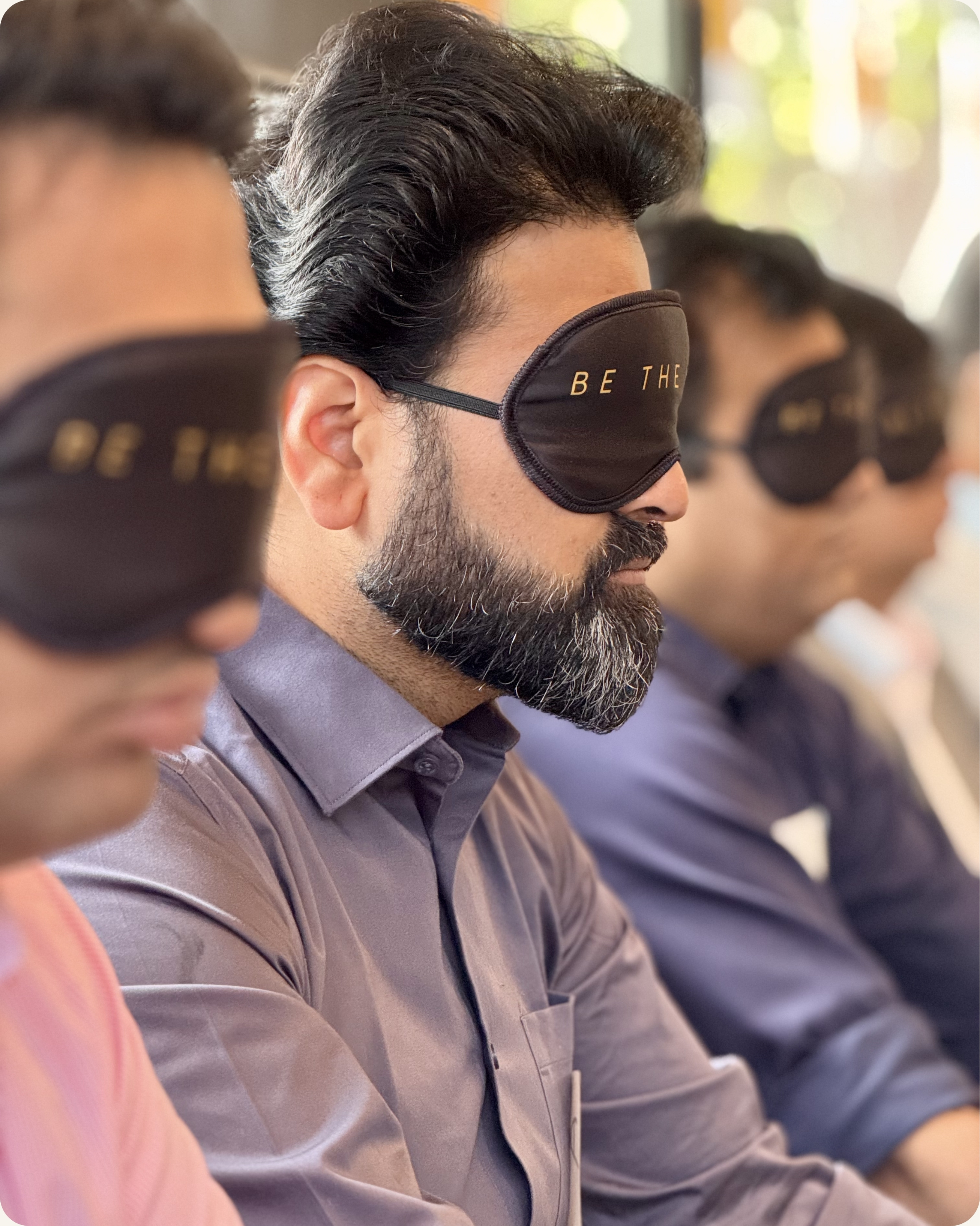 Indian professionals in mindfulness exercise during executive presence training in Dallas Texas — CoachVikram & Company