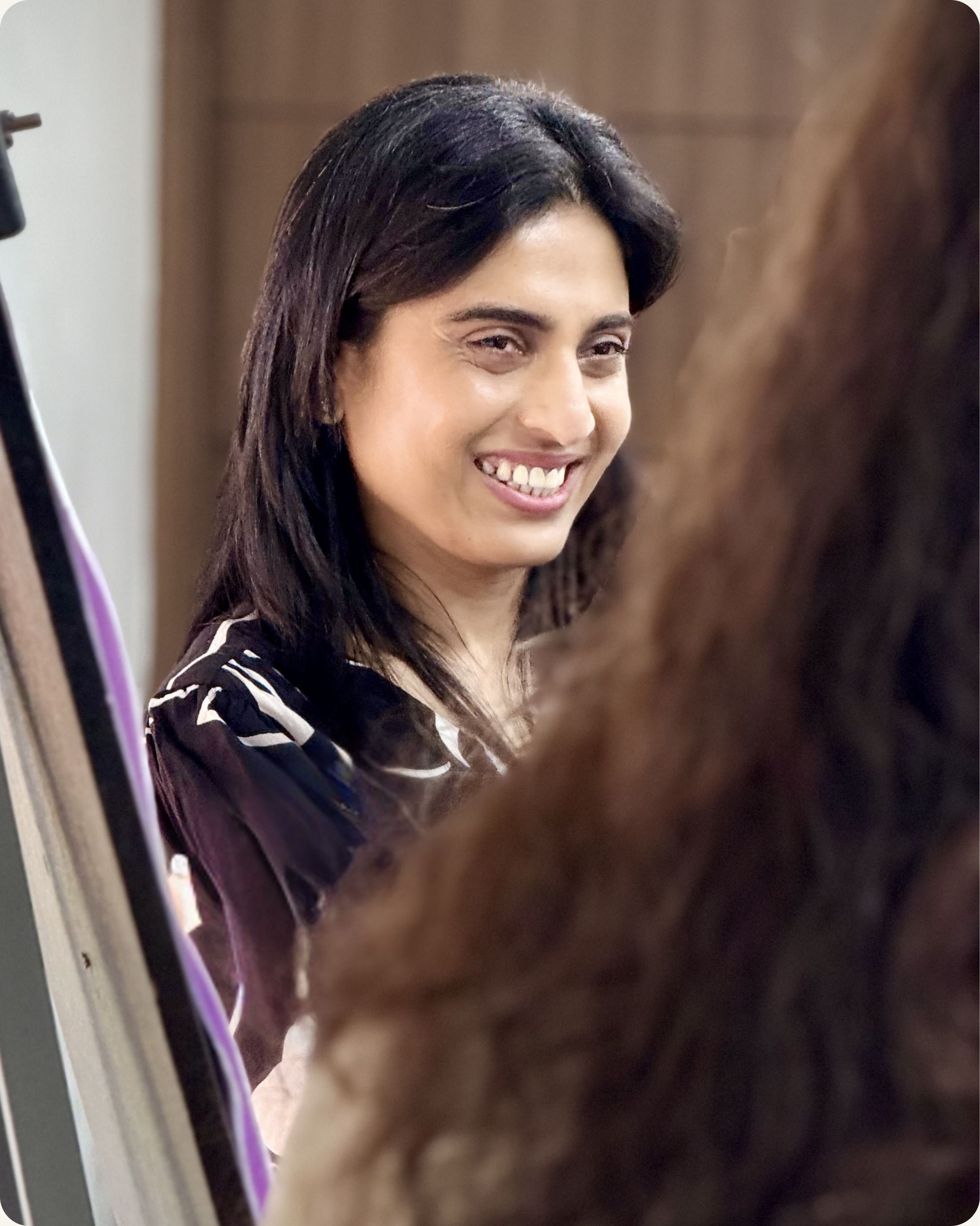 Senior leader smiling joyfully during executive presence workshop session in Washington DC — CoachVikram & Company