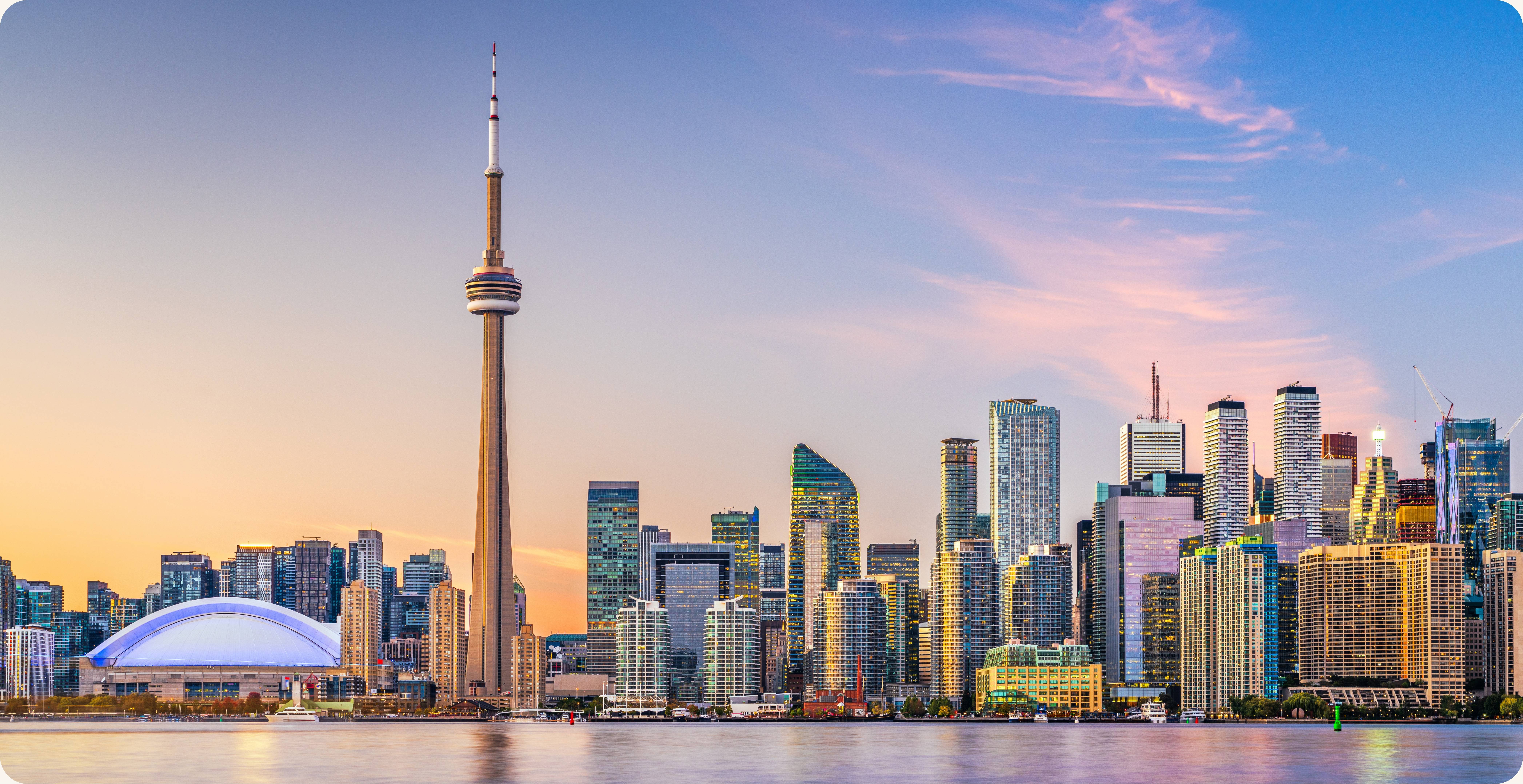Toronto Ontario skyline with CN Tower at sunset — executive presence training and coaching for financial and technology leaders by CoachVikram & Company