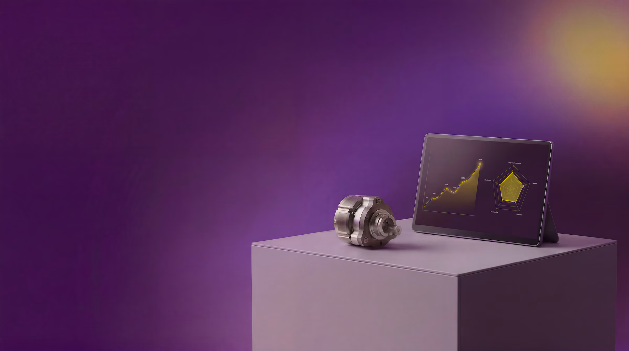 Motor next to tablet with yellow charts on purple pedestal against purple background.