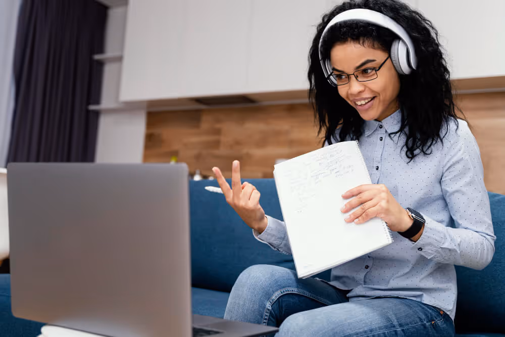 image of a focused young professional (wearing headphones, with a laptop/papers) overlaid with text about Discovering Your Purpose and gaining alignment, confidence, and clarity