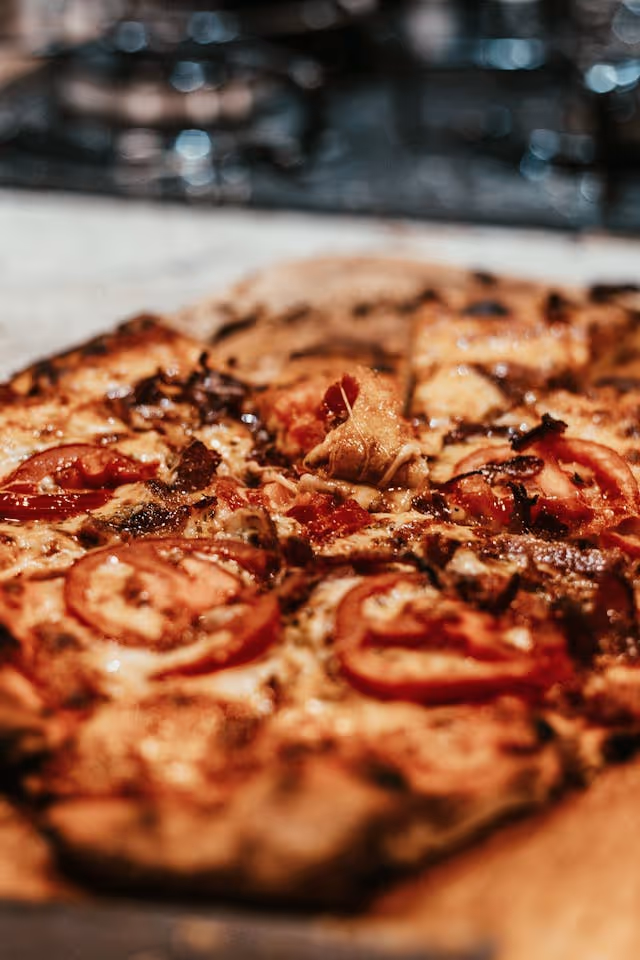 a pepperoni pizza on a table
