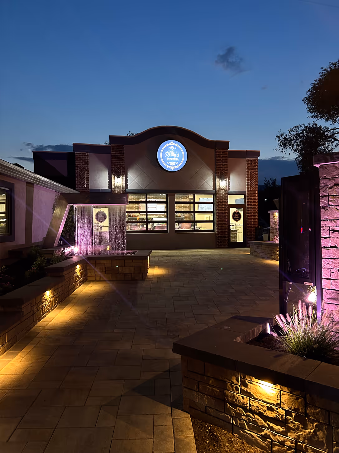 Tilly's pizzeria from the outside at night seen from the left