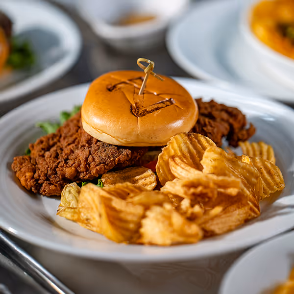 Crispy chicken fried sandwich with house-made chips served at Z’s Restaurant in Winnsboro, Texas. A local favorite featuring fresh ingredients, bold flavor, and signature small-town hospitality.