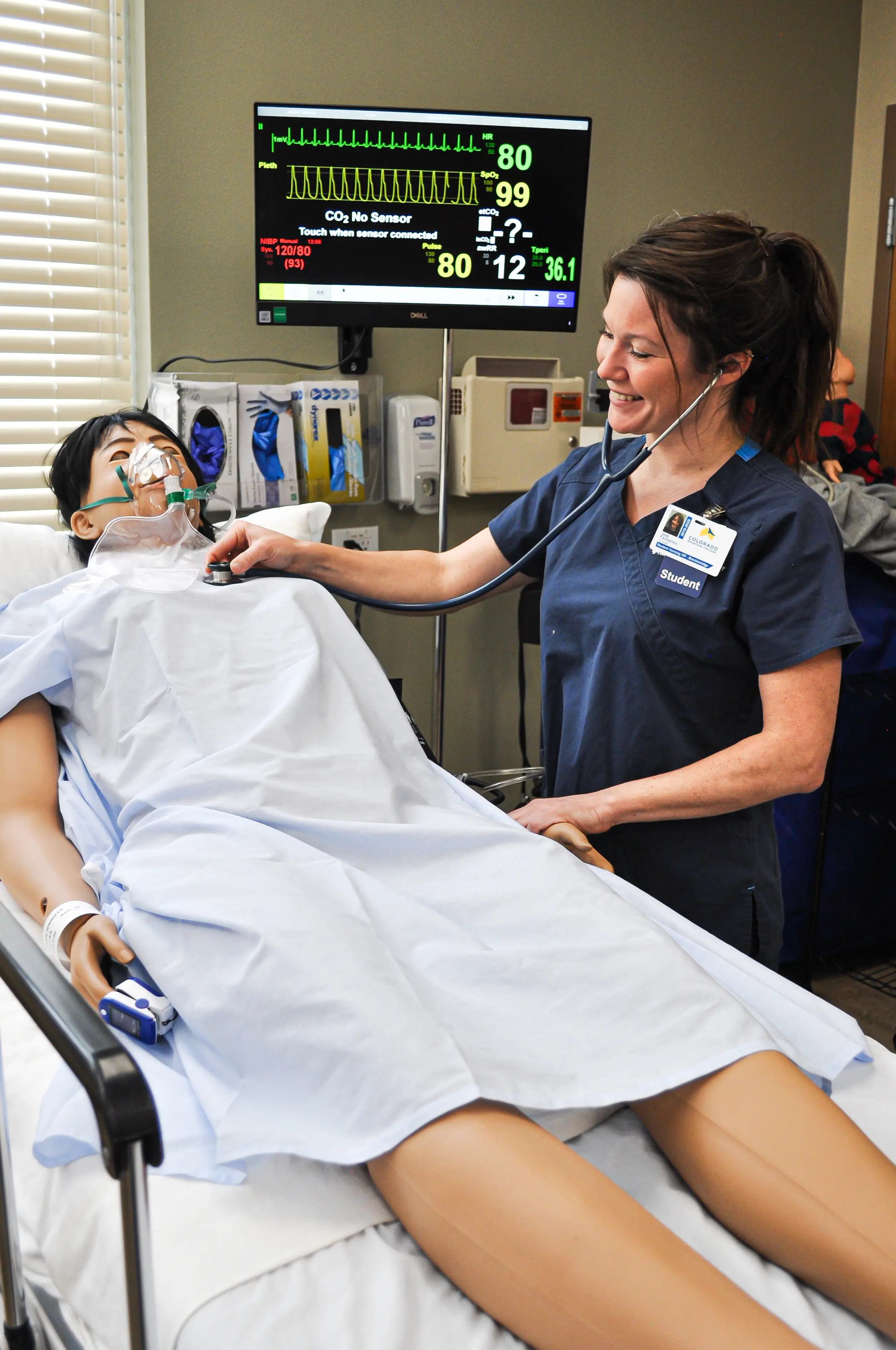 nursing student using techniques on dummy
