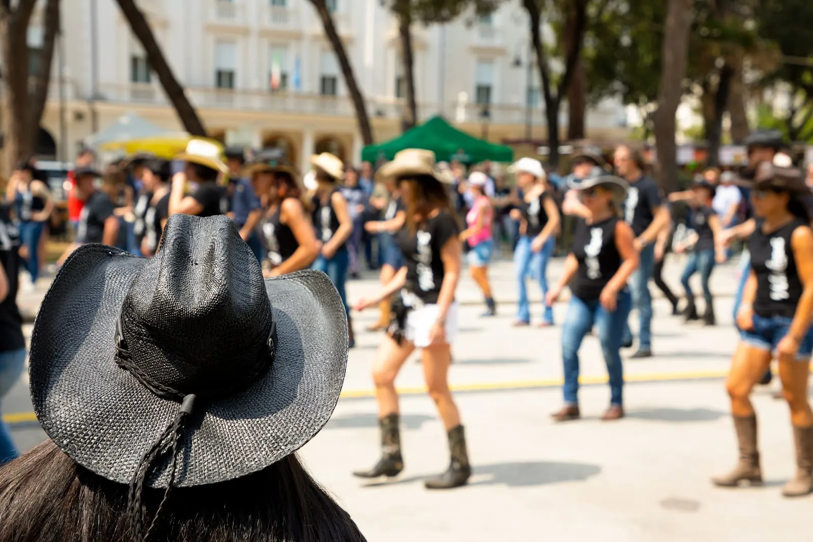 Group of people wearing western wear line dancing