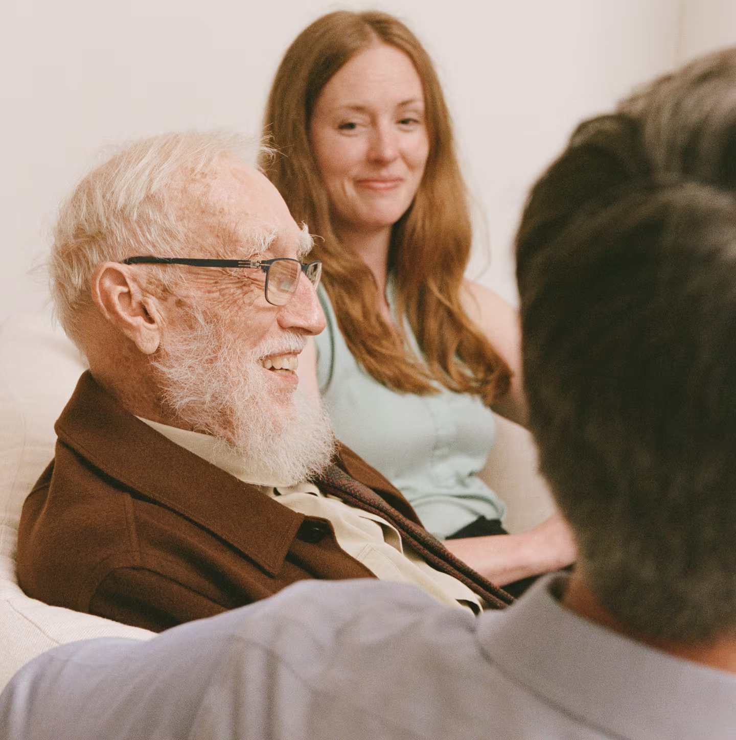 Elderly people smiling in a reunion