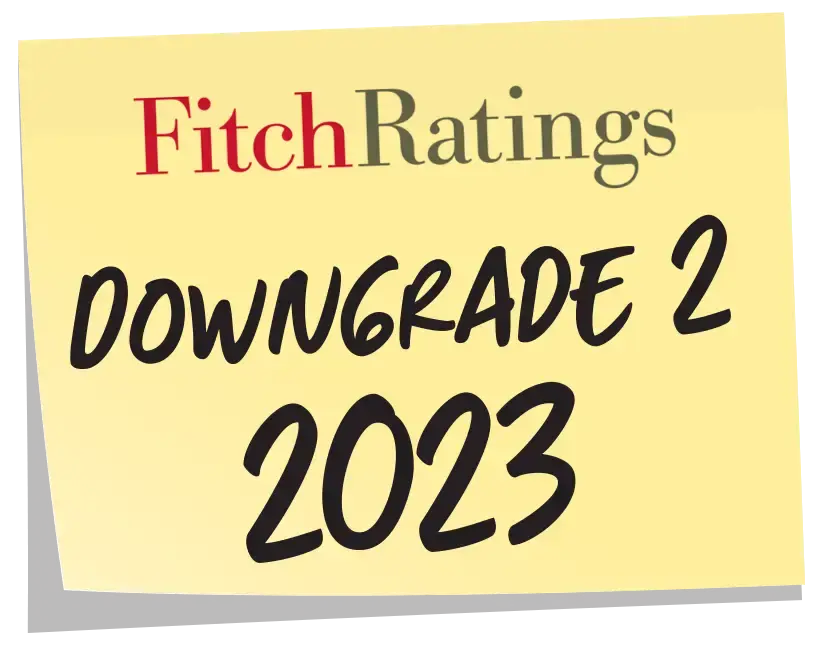 Yellow sticky note with Fitch Ratings logo and text Downgrade 2 2023 in black and red font.