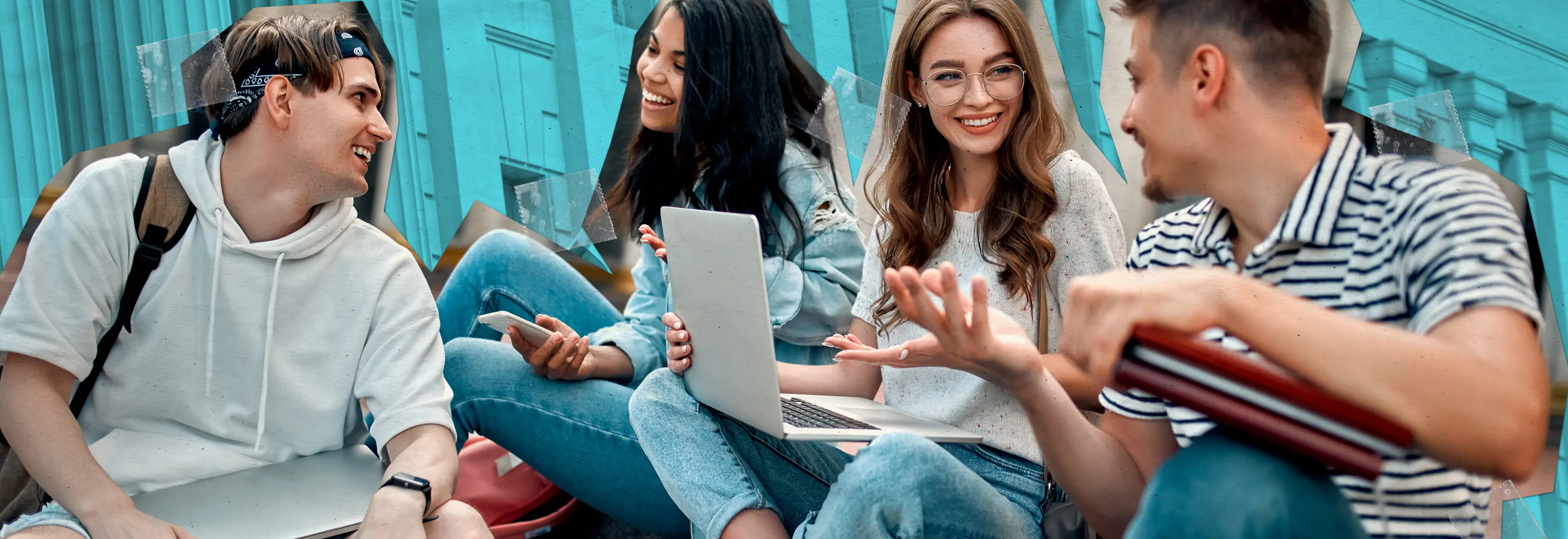 Four young adults sitting together outside, talking and smiling over a laptop and notebooks.