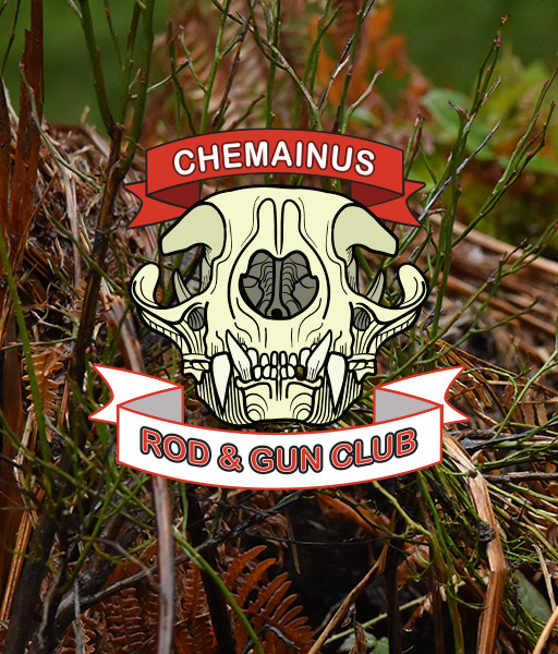 Illustration of a stylized animal skull with a red banner above reading 'CHEMAINUS' and a white banner below reading 'ROD & GUN CLUB', set against a background of green moss and brown twigs.