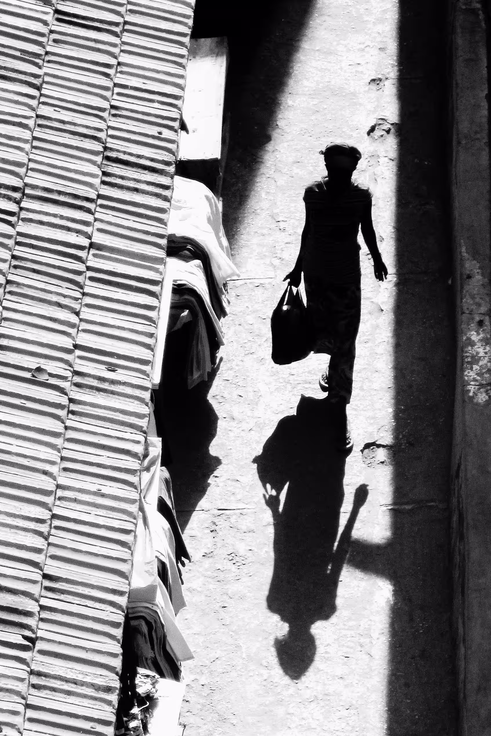 Silhouette Photography of Person Waling on Street.