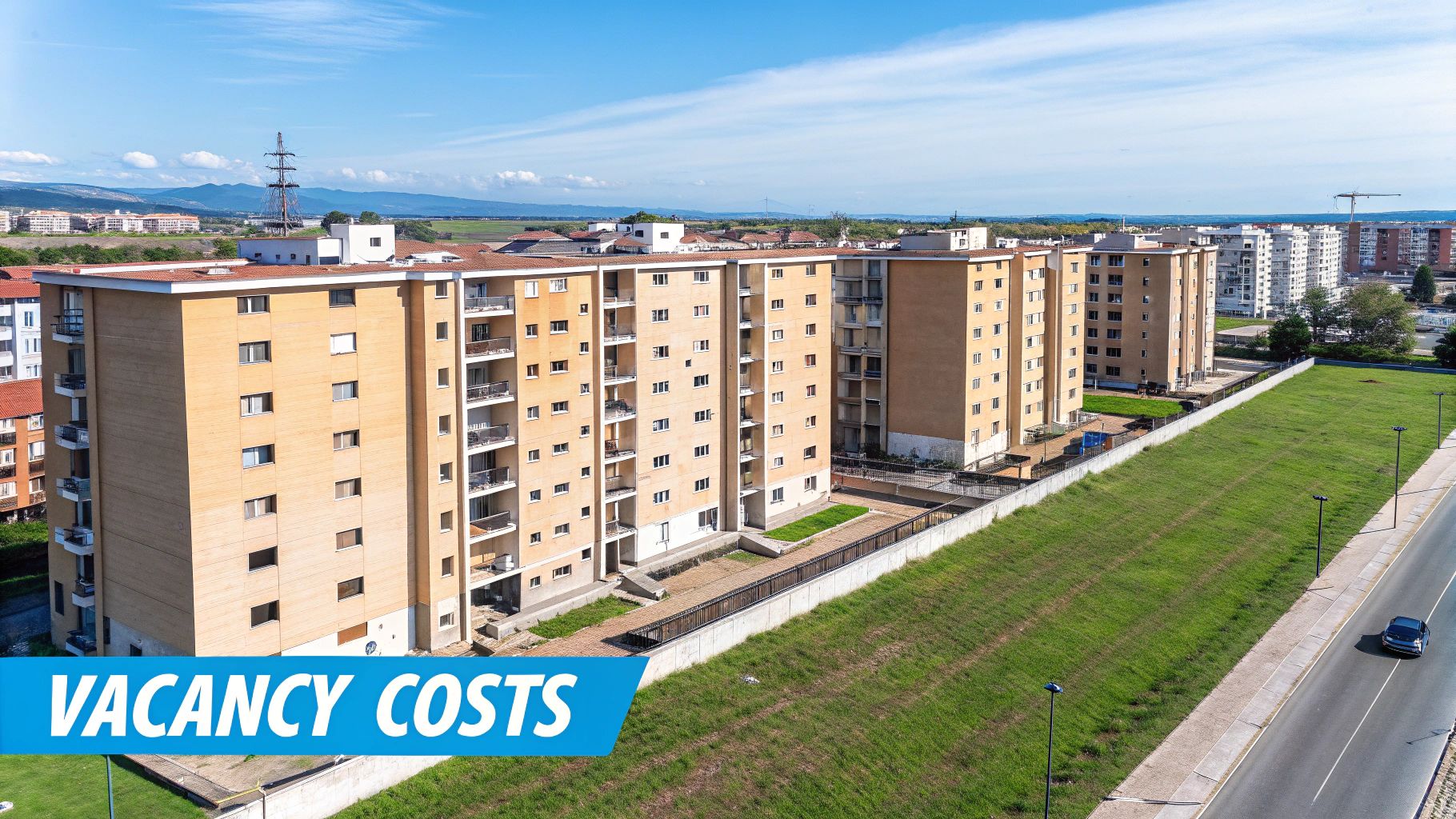 A person working on a laptop with a focused expression, representing a property manager analyzing vacancy costs.
