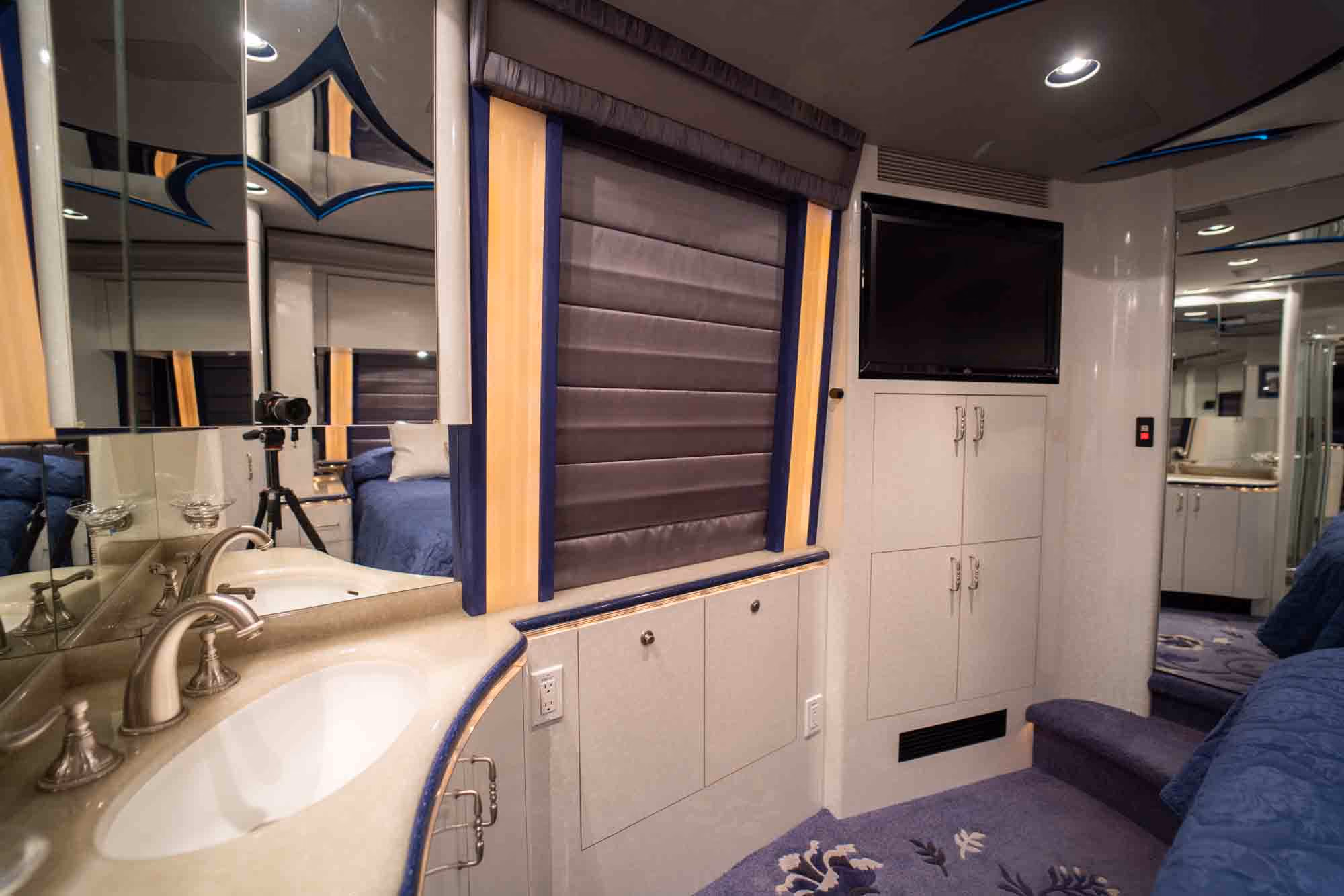 Interior living area with double-slide layout in Marathon Coach 1038