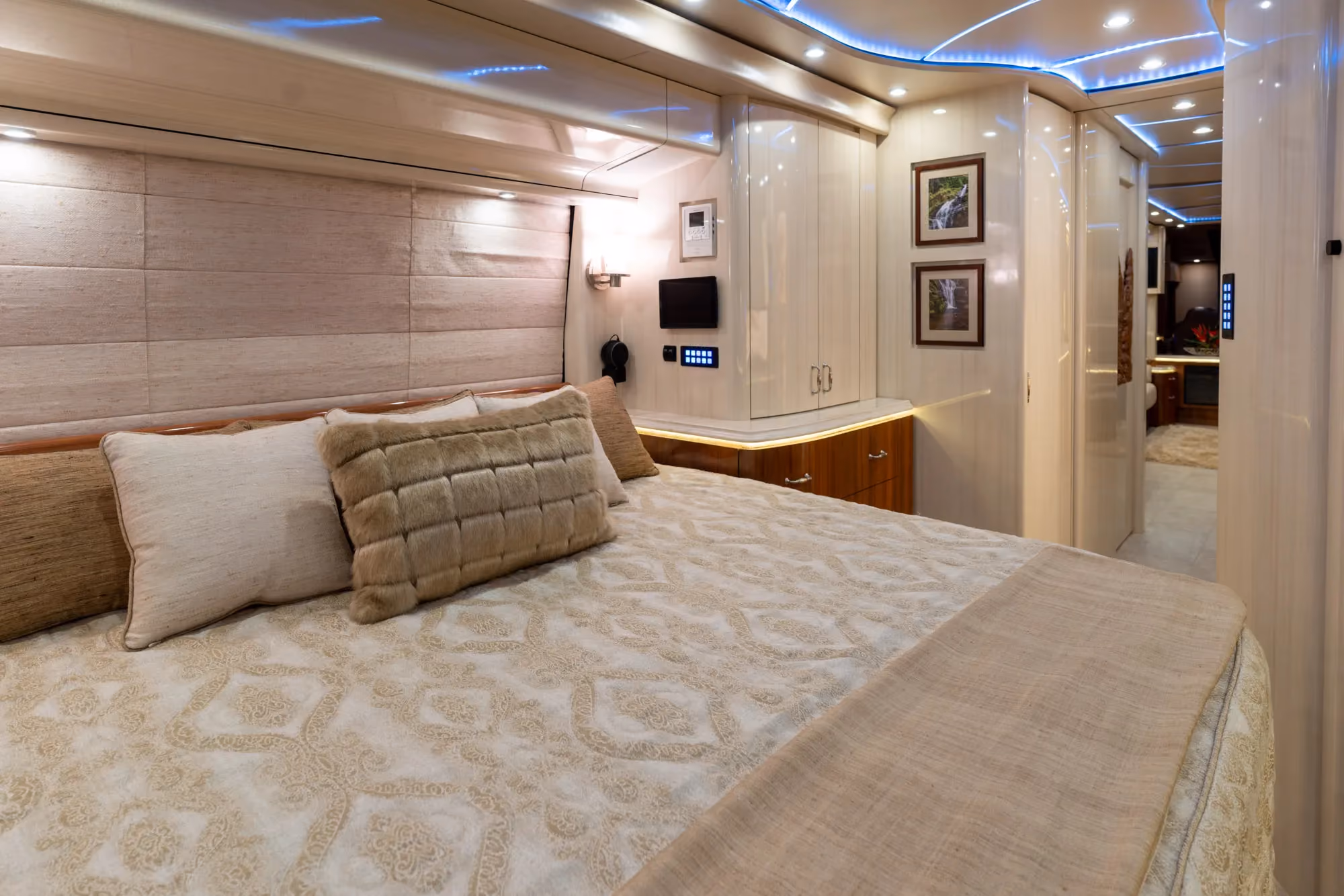 Interior rear bedroom suite with adjustable reclining king bed in Marathon Coach 1325