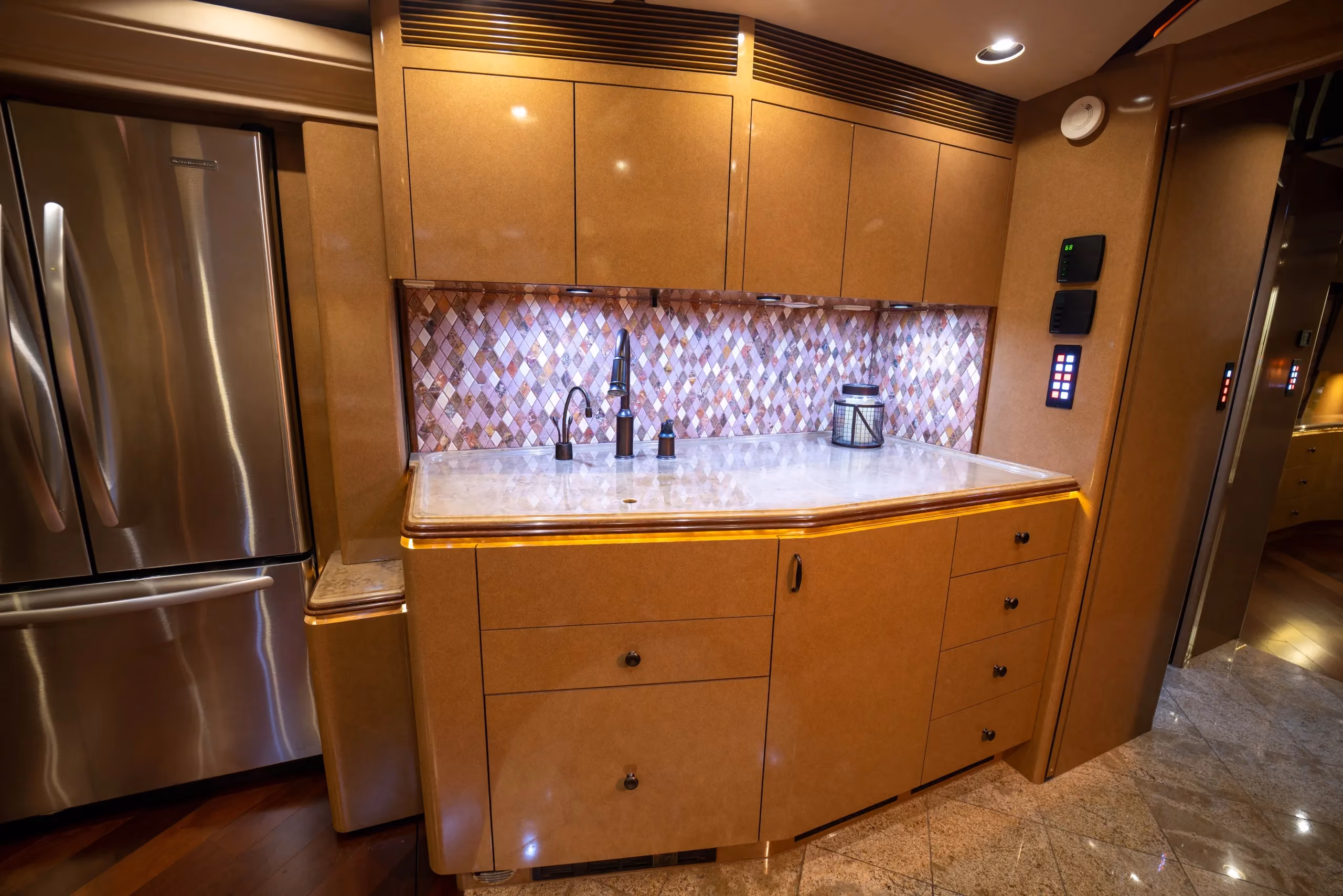 Interior galley countertop and appliances in Marathon Coach 1176