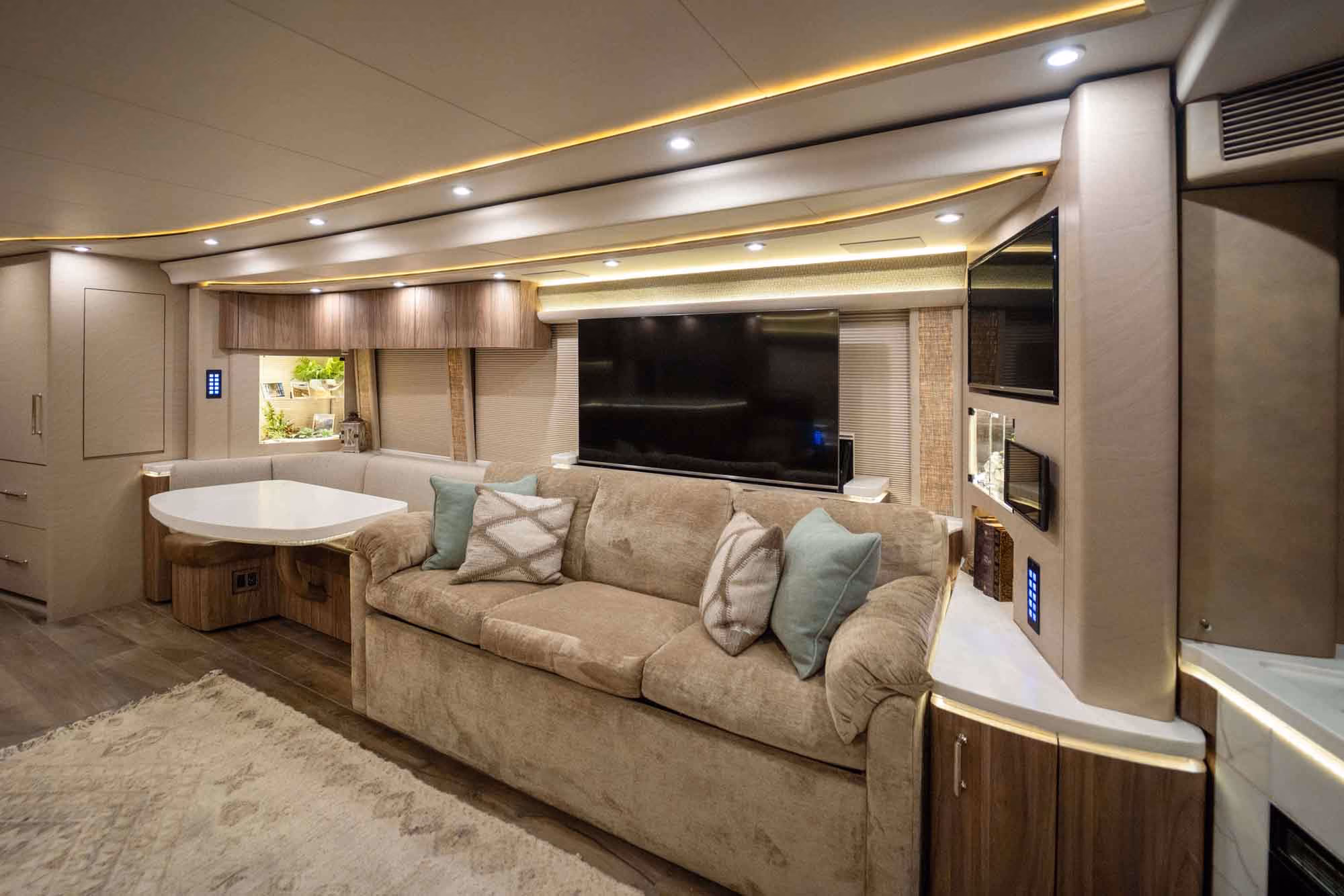Interior living area of Marathon Coach 1287 with heated flooring throughout