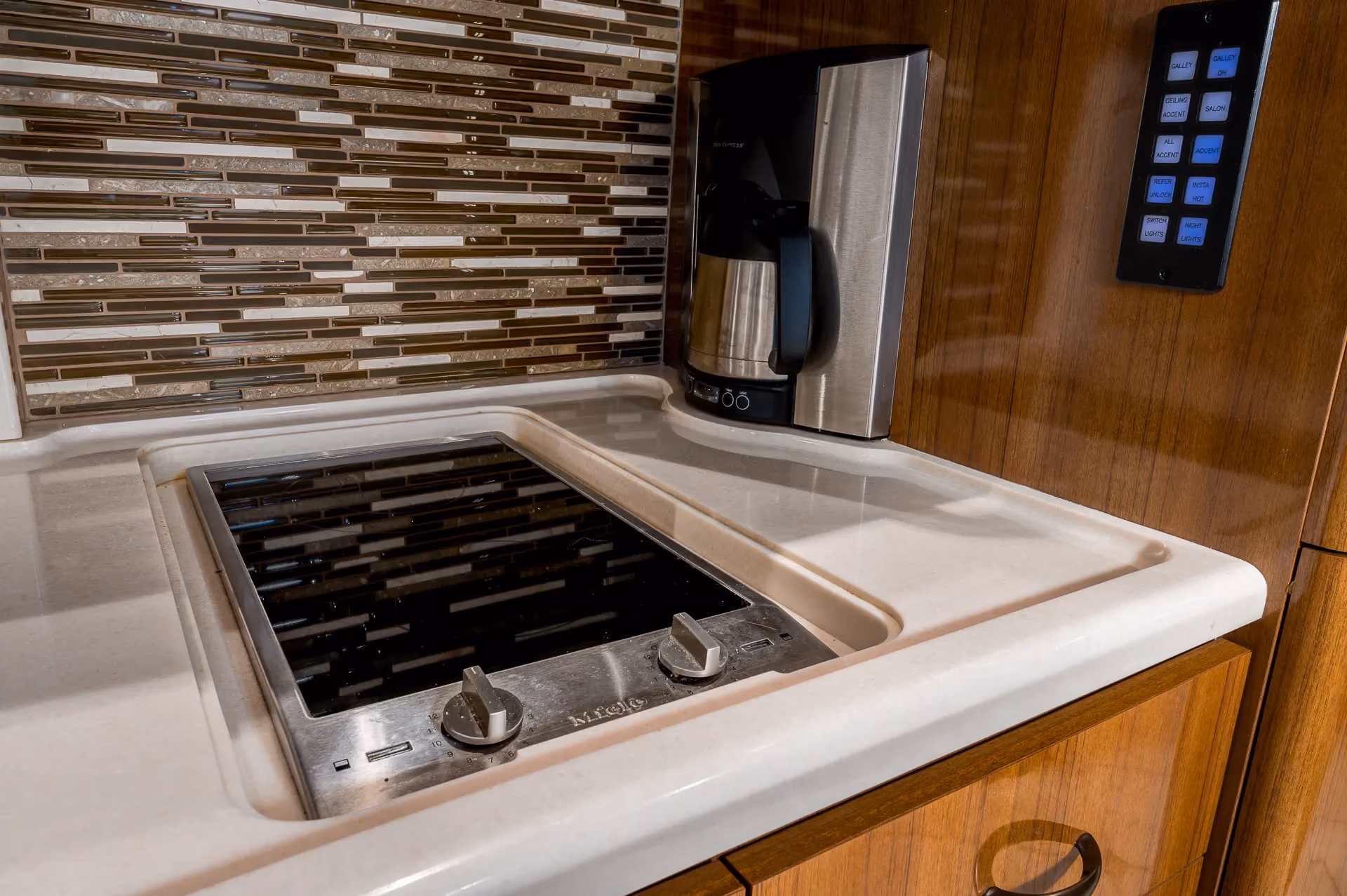 Exterior outdoor kitchen with Electric Chef grill and rotisserie on Marathon Coach 1208