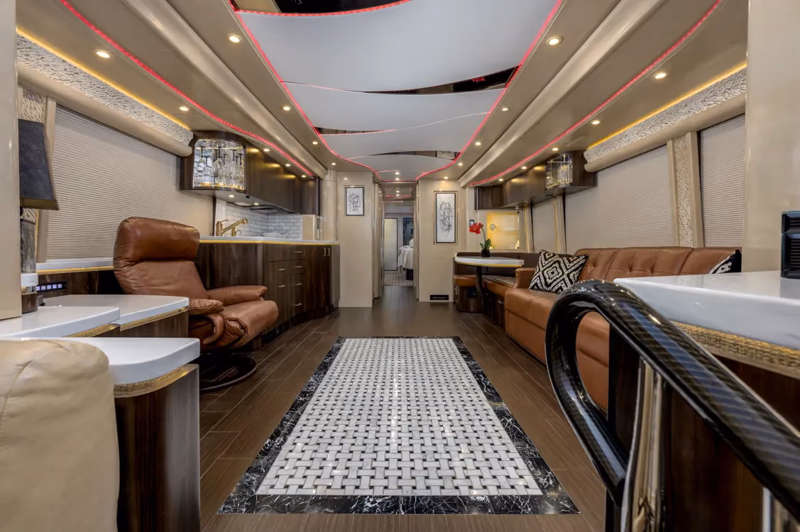 Interior salon of 2017 Marathon Coach 1258 with fireplace insert