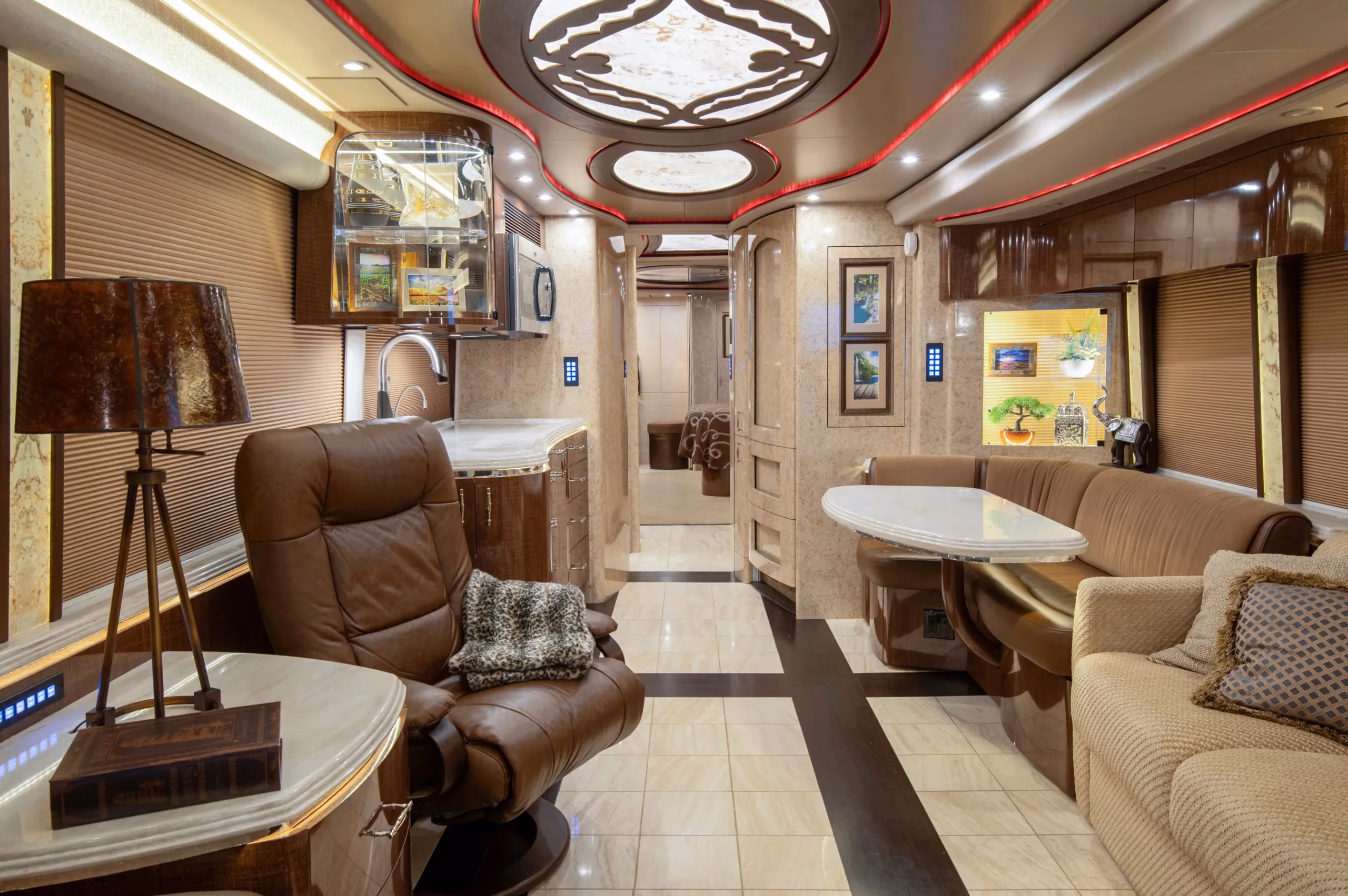 Interior salon of 2015 Marathon Coach 1219 with L-shaped leather dinette