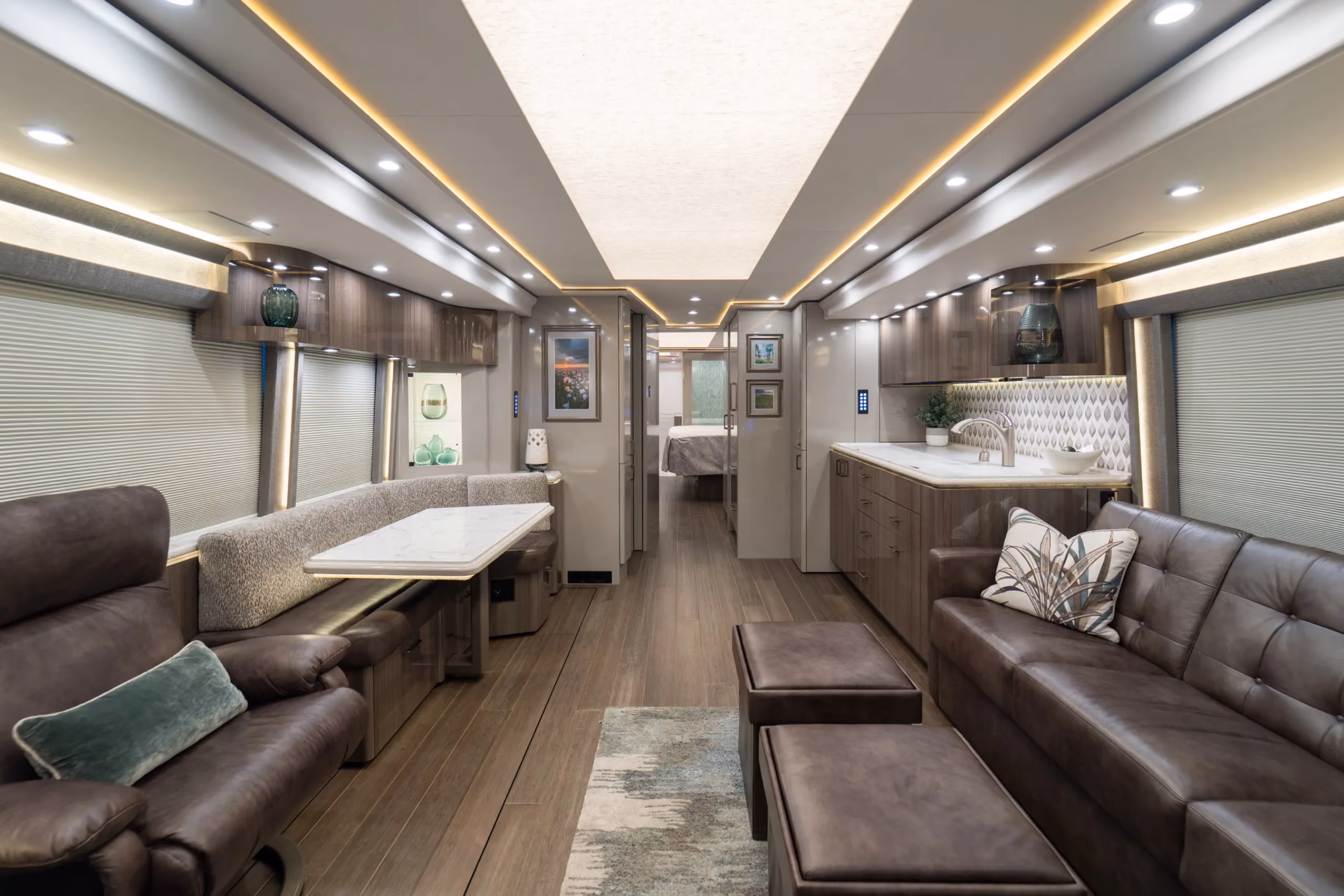 Interior salon of 2022 Marathon Coach 1341 with underfloor heating and quad-slide layout