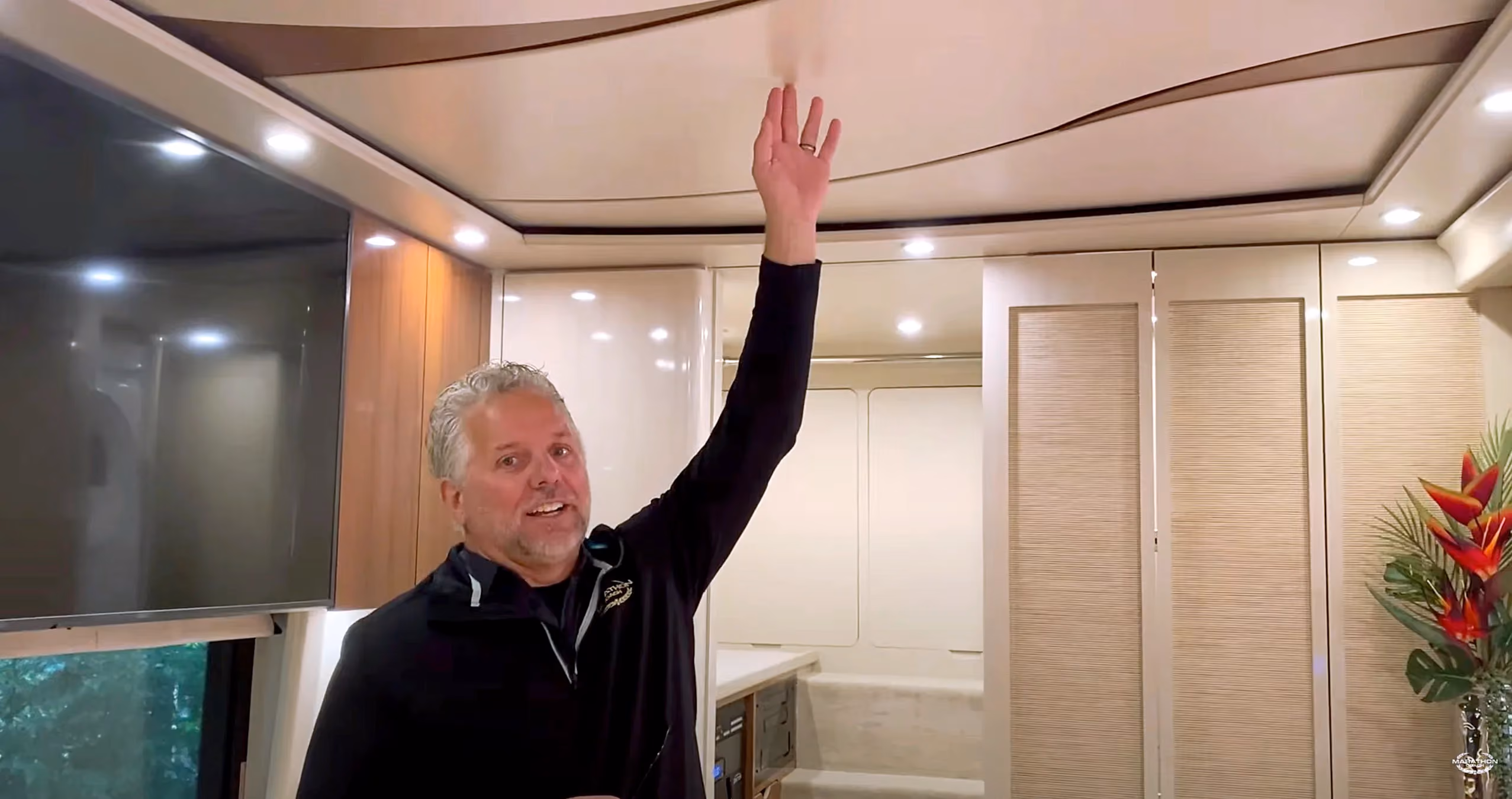 Randy showing some of the singular features of 2021 Marathon Show Coach 1325