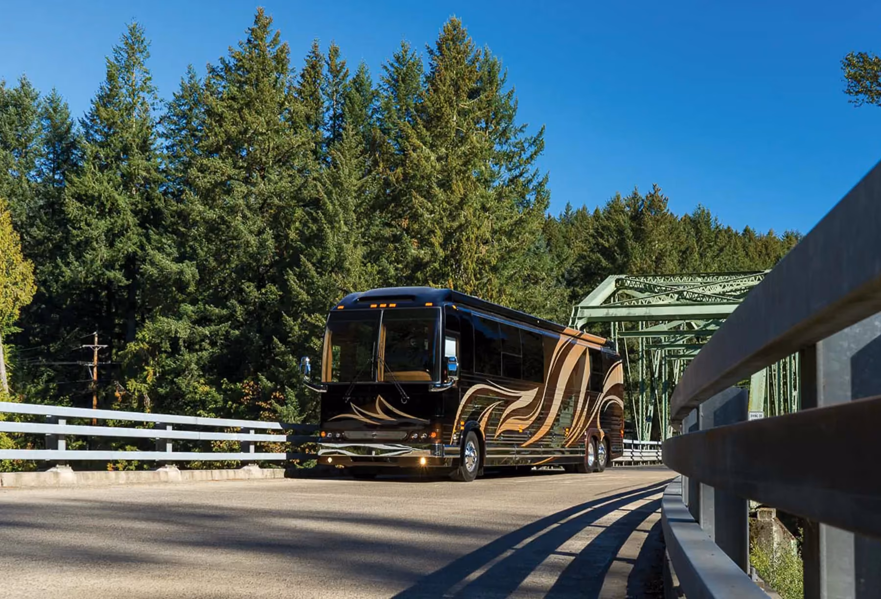 A classic Marathon Coach driving over a bridge