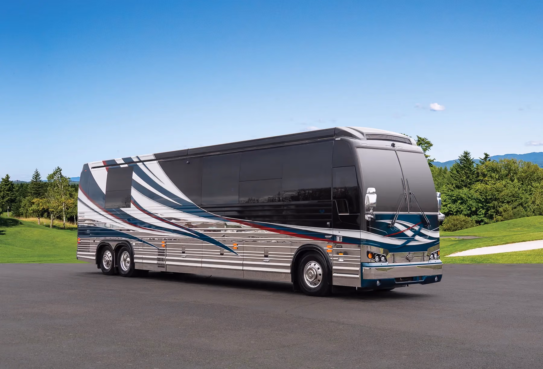 A Marathon Coach parked next to a golf course