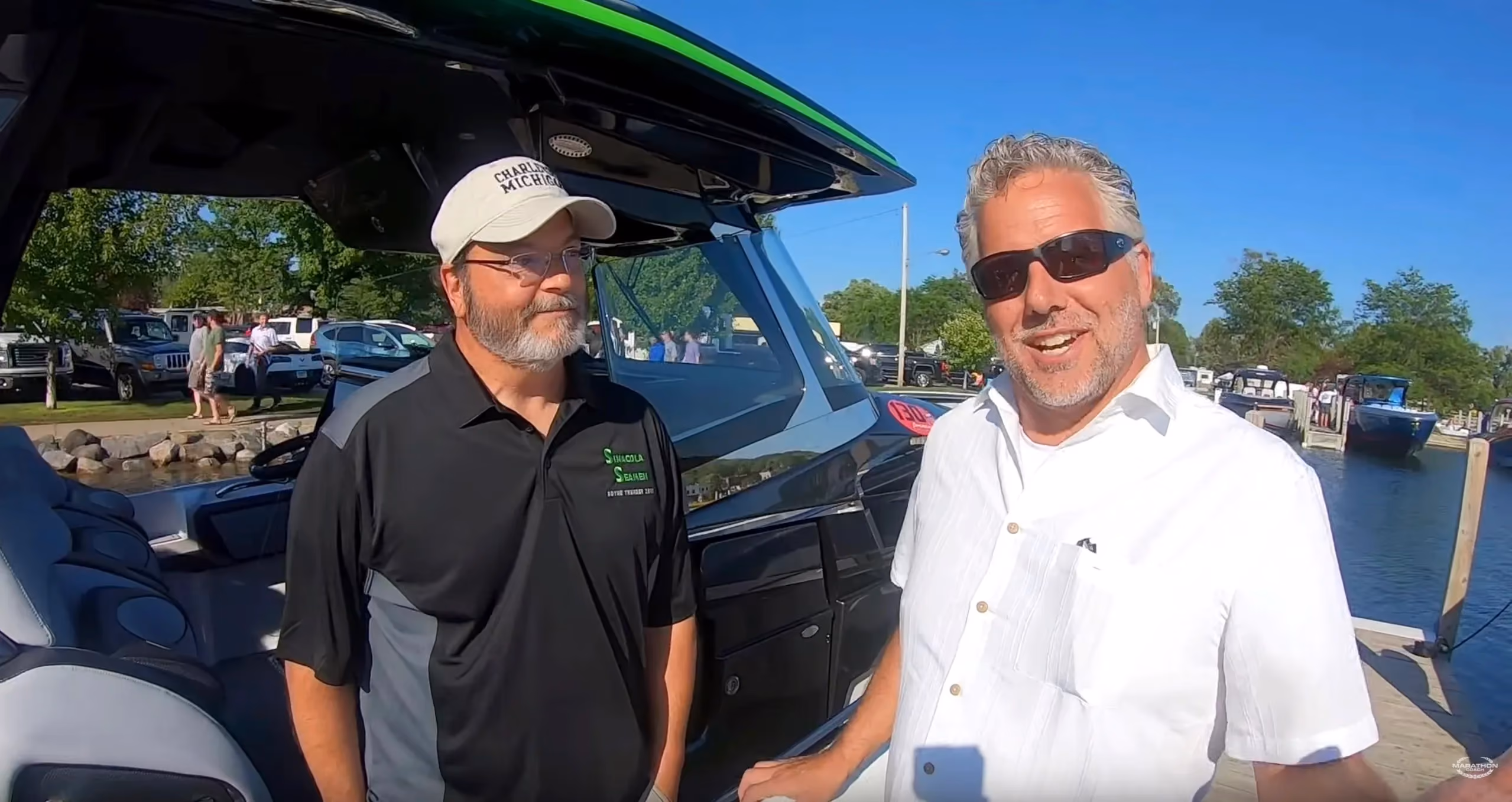 Randy chats with a boat racer in Boyne City for the annual charity Boyne Thunder power boat race