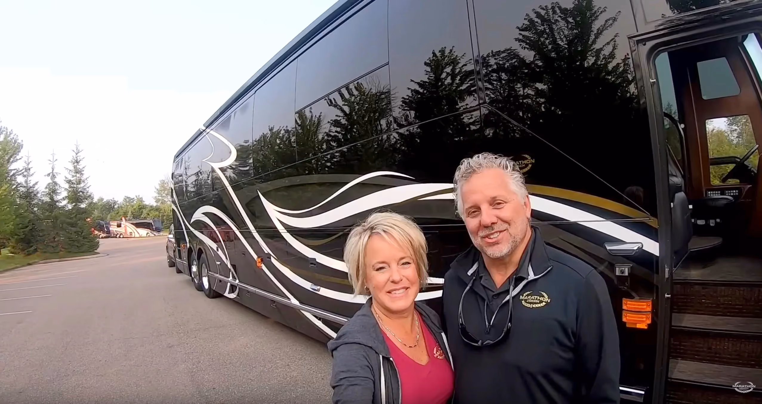 Randy and Dawn standing in front of Marathon Coach 1300