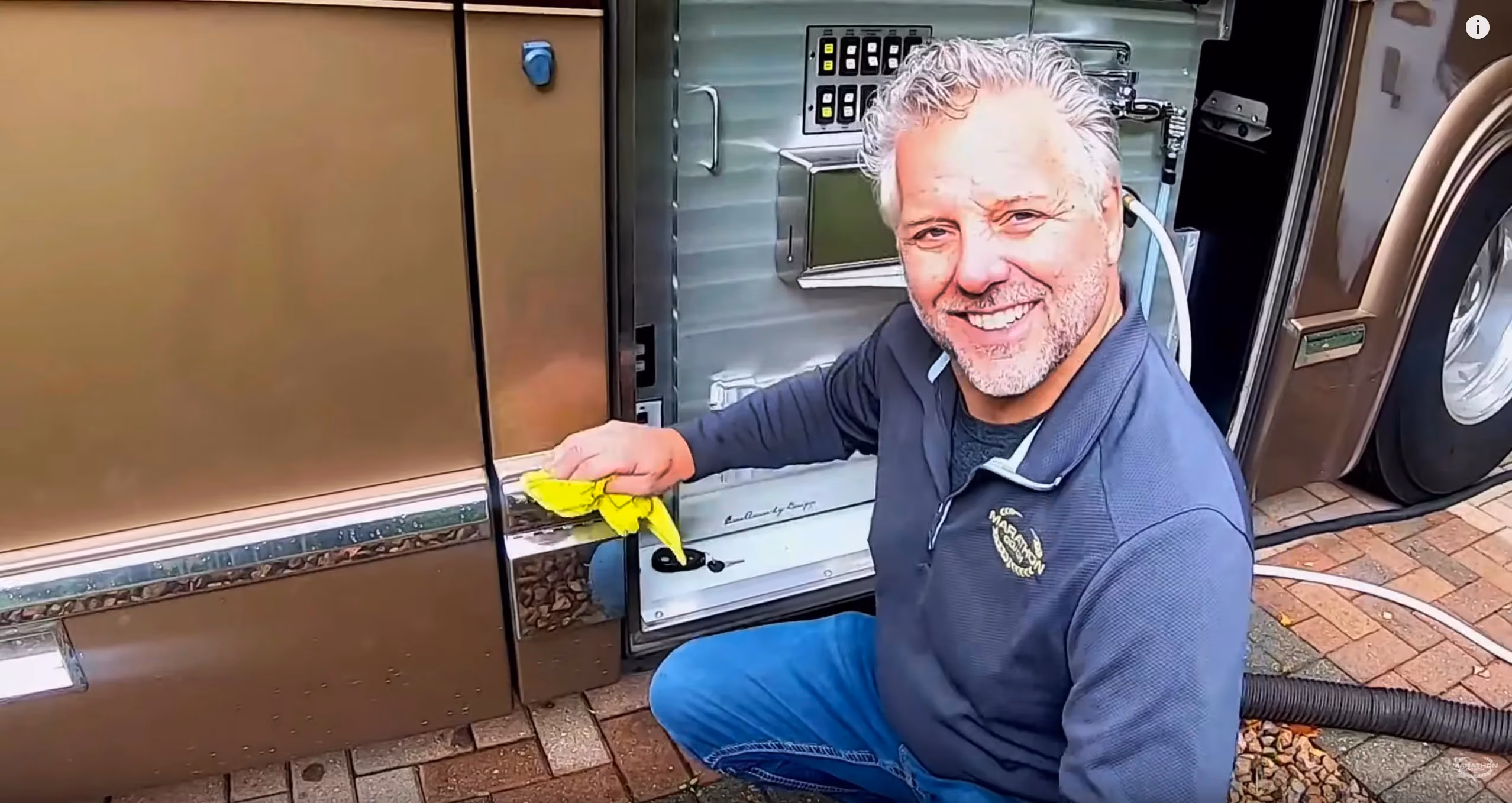 Randy cleaning up their luxury RV