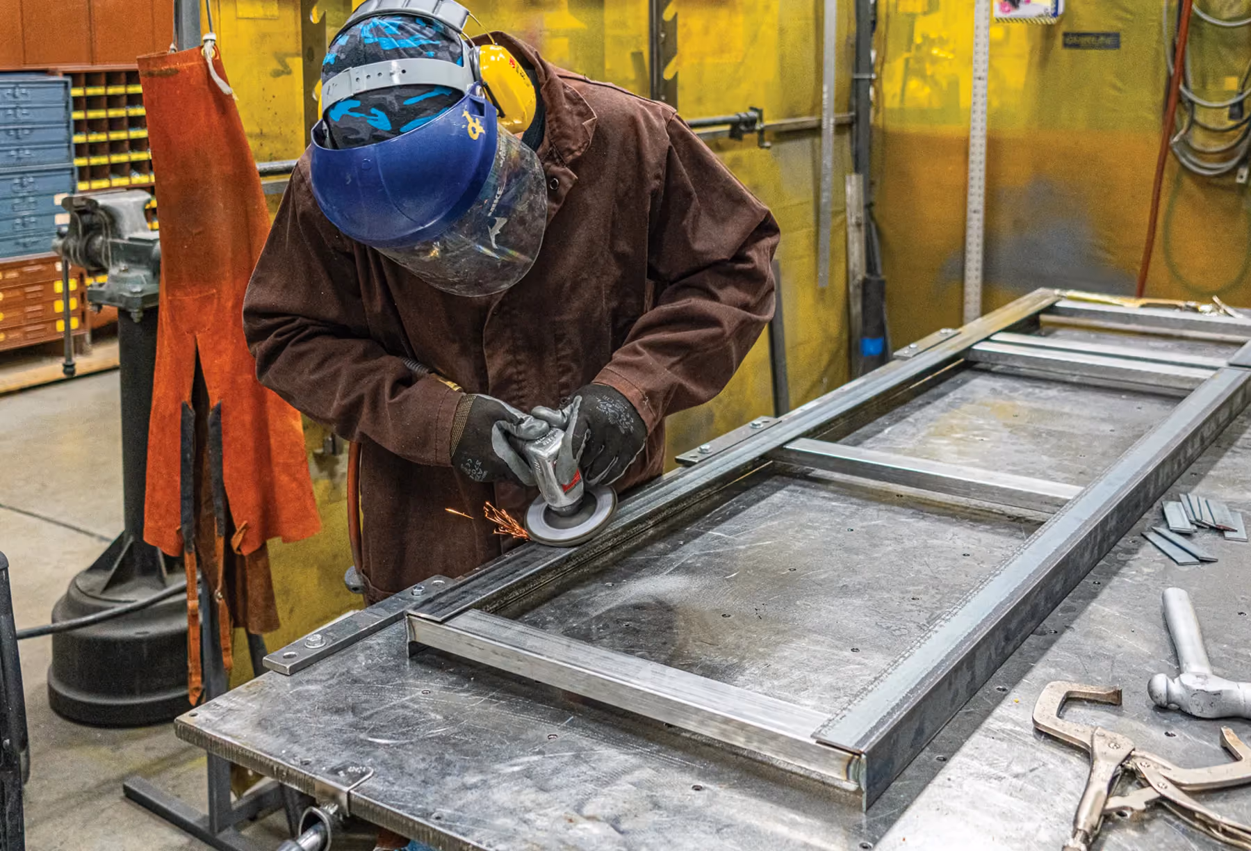 A marathon coach employee working on metal fabrication