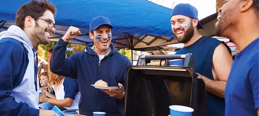 Fans tailgating at a sporting event