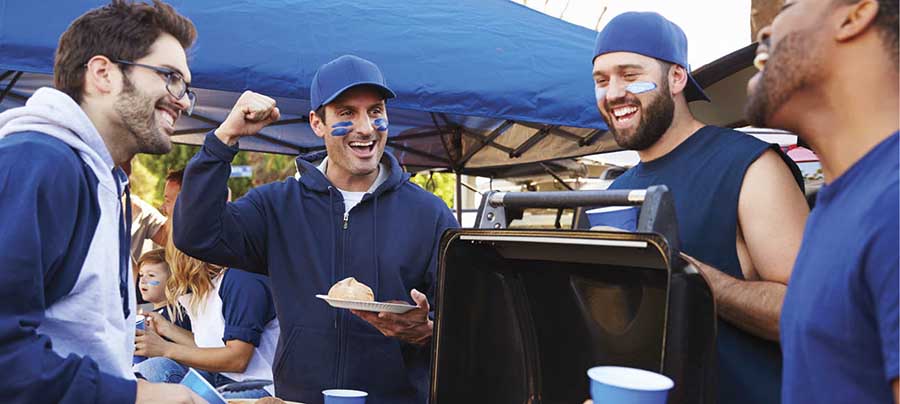 Fans tailgating at a sporting event