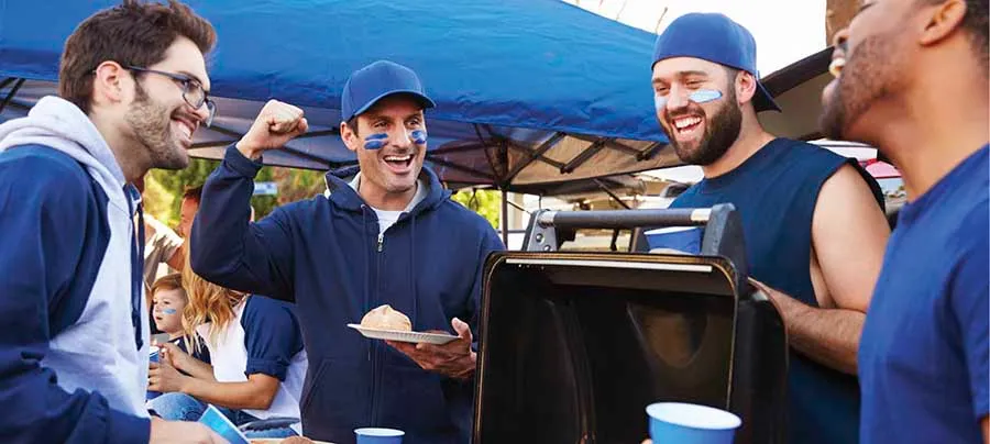 Fans tailgating at a sporting event