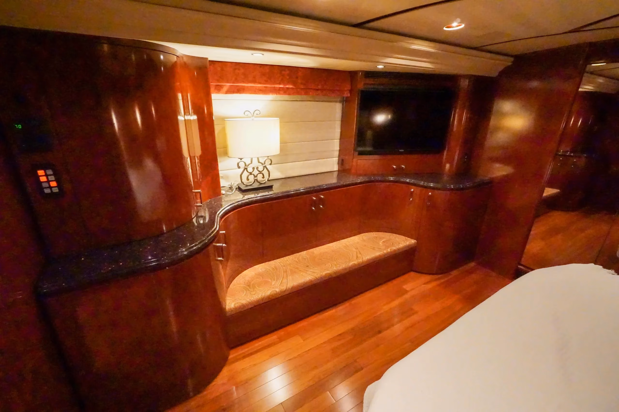 Interior bedroom with new cherry wood floor in Marathon Coach 1097