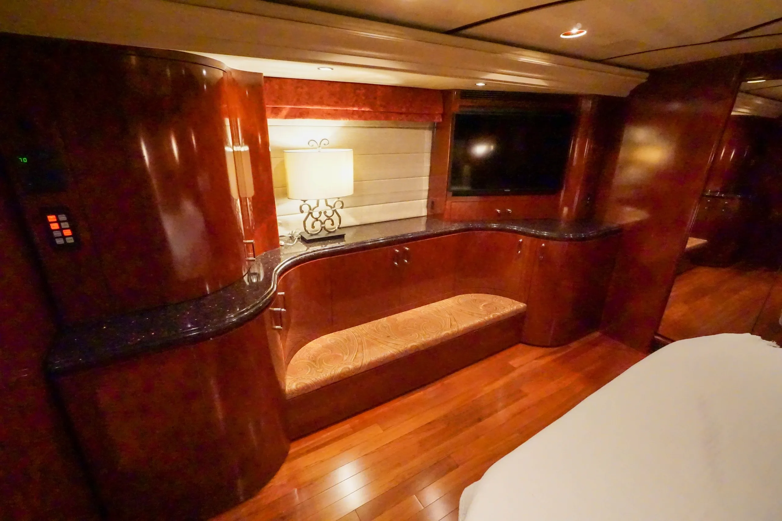 Interior bedroom with new cherry wood floor in Marathon Coach 1097
