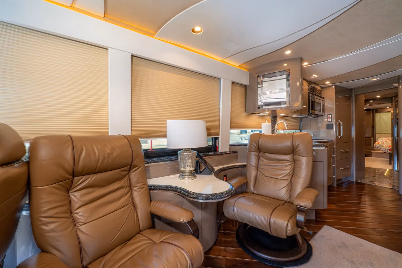 Interior living area with wood plank flooring in Marathon Coach 1153