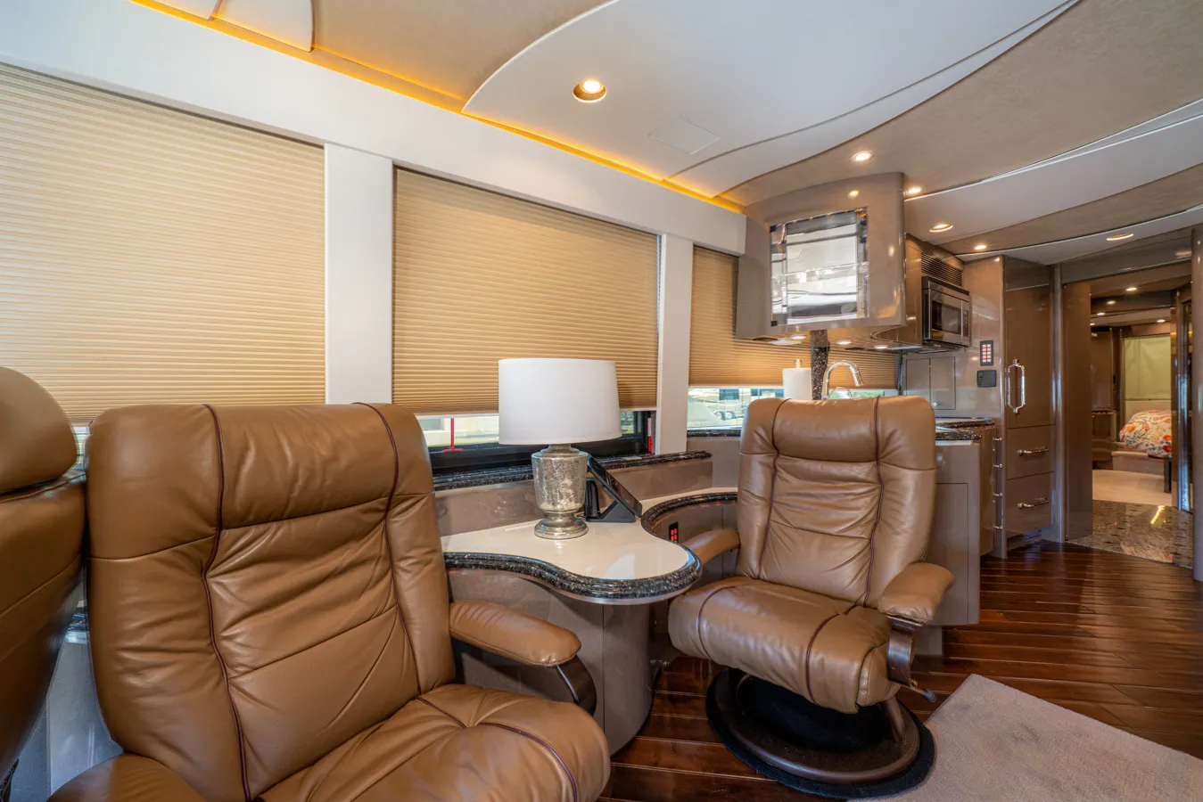 Interior living area with wood plank flooring in Marathon Coach 1153