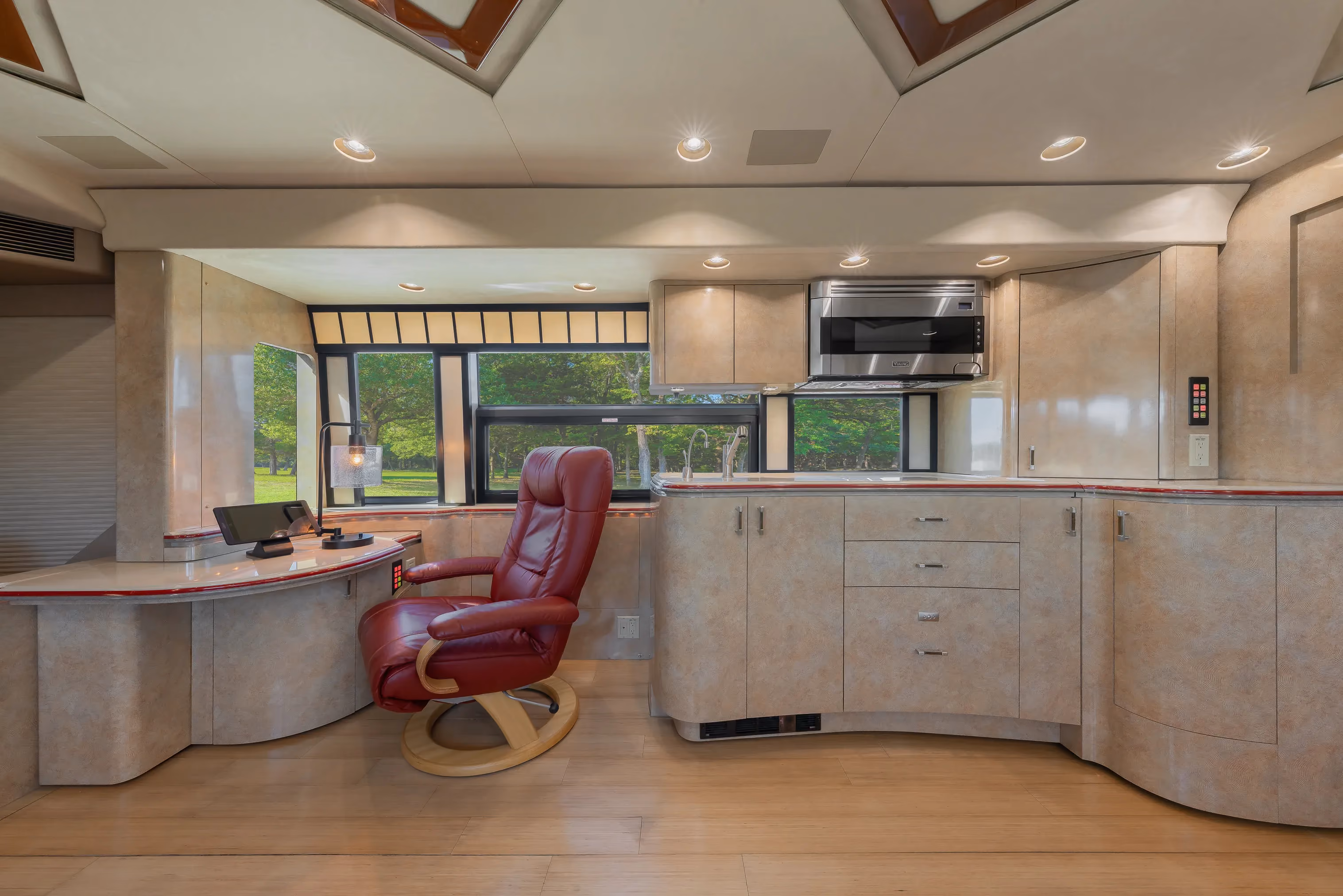 Interior salon cabinetry with Crestron audio controls in Marathon Coach 1154