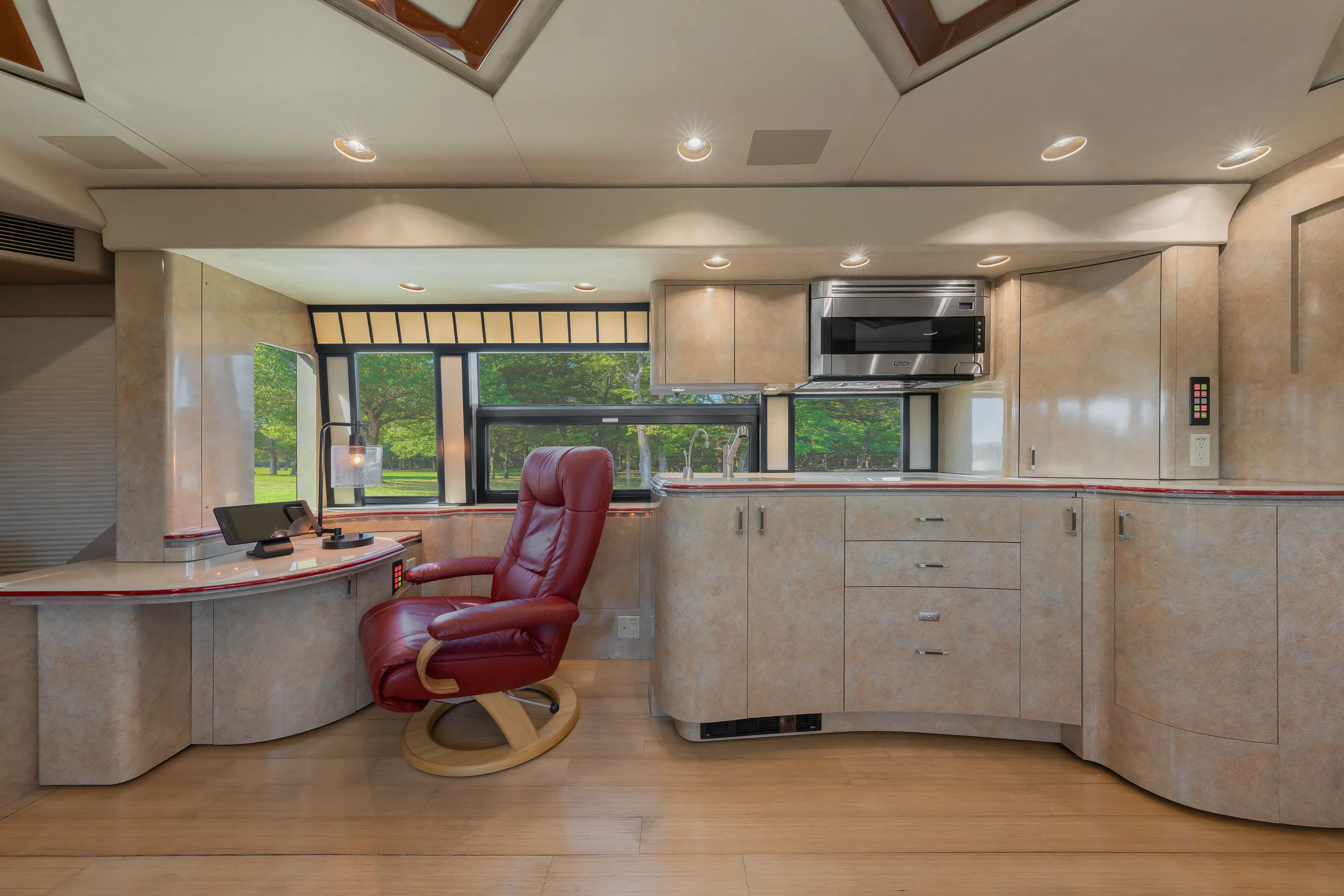 Interior salon cabinetry with Crestron audio controls in Marathon Coach 1154