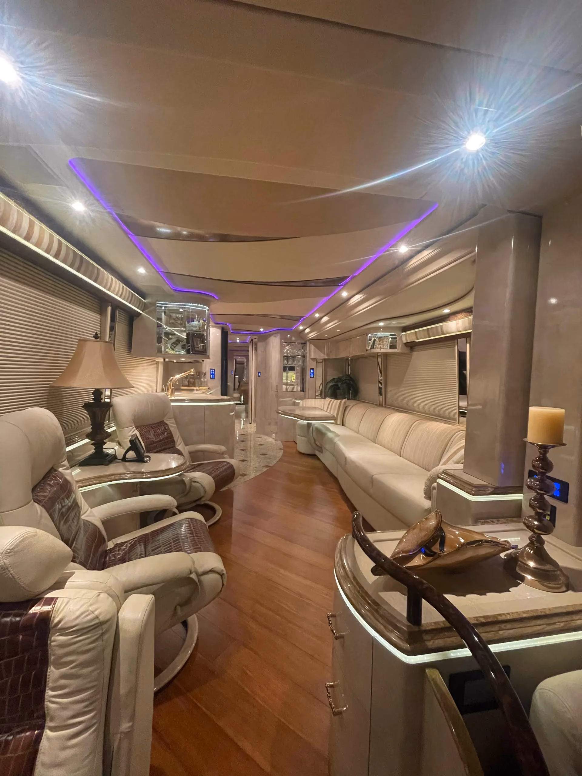 Interior salon of 2012 Marathon Coach 1202 with granite layout